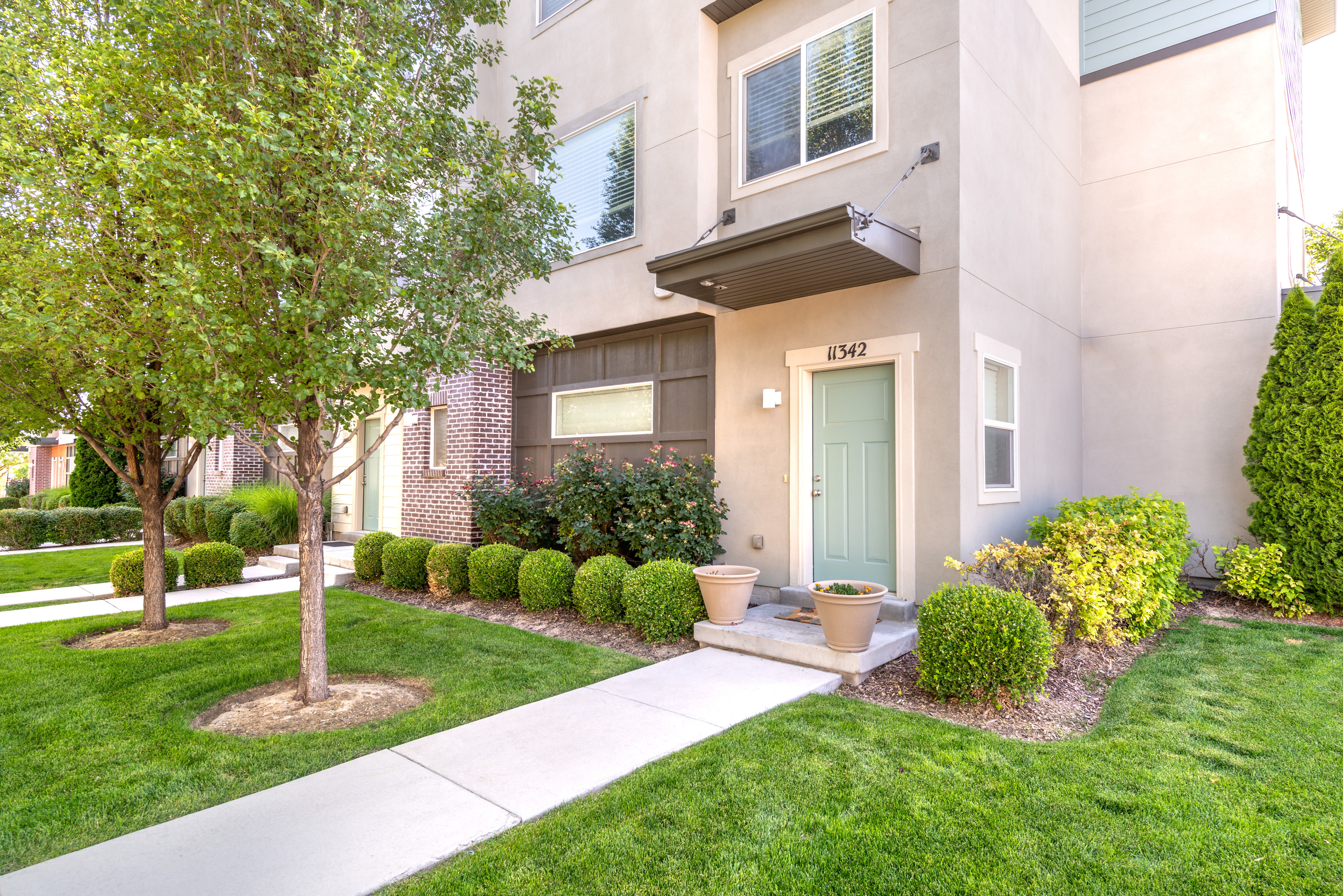 Exterior of apartment entrance at Olympus at the District in South Jordan, Utah