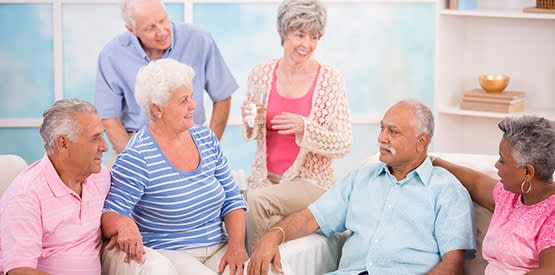 Group of seniors gathered at Grand Villa of Palm Coast in Palm Coast, Florida