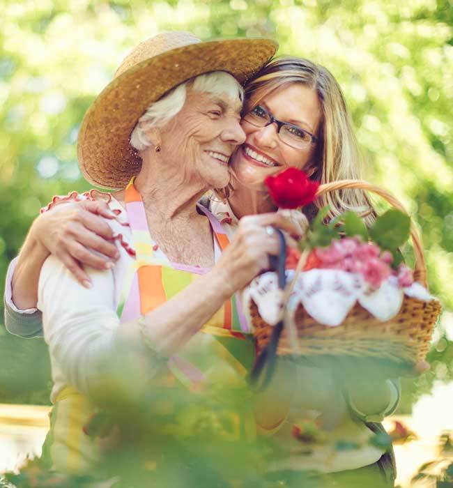 A daughter hugging her mom at The Stilley House Senior Living in Benton, Kentucky. 