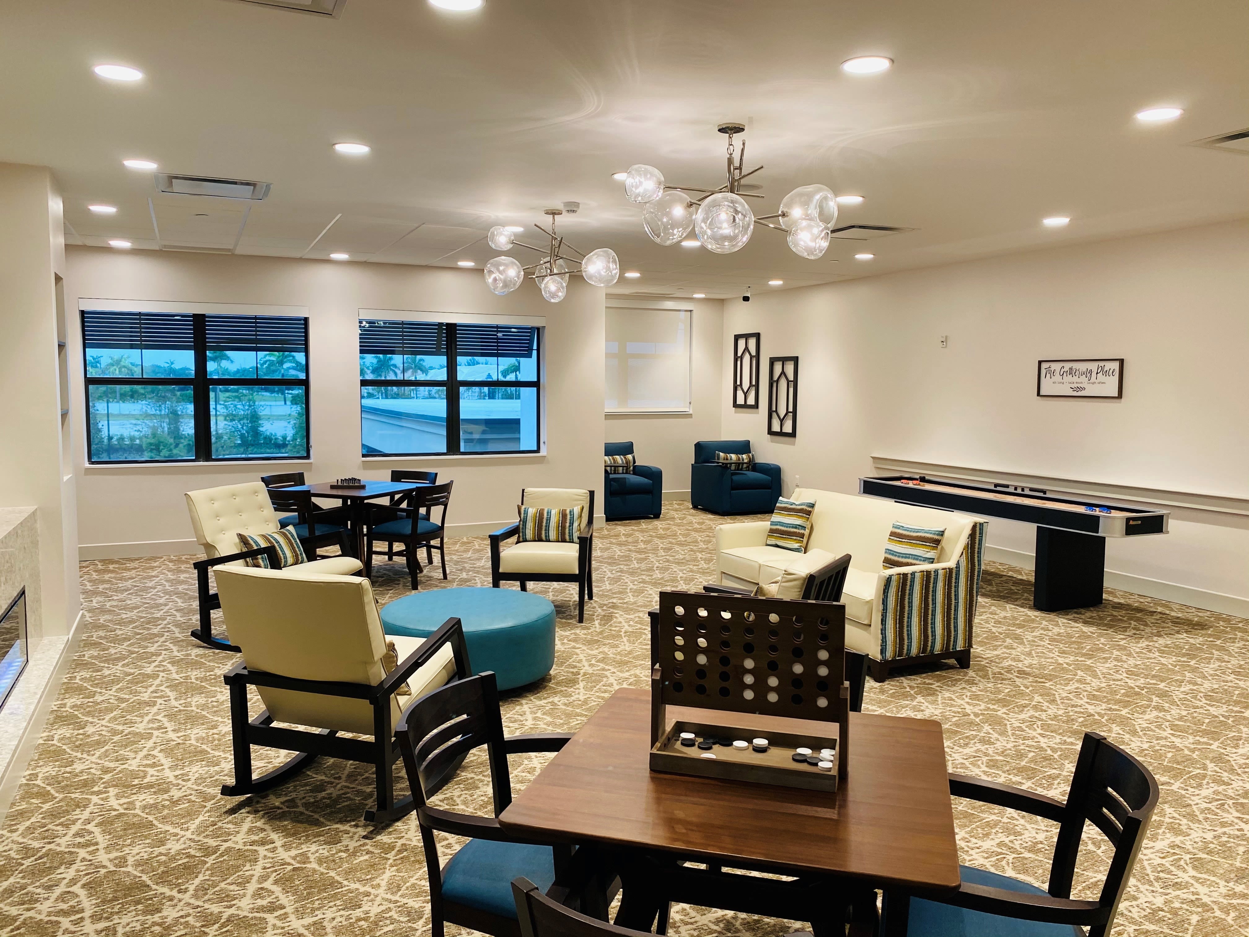 Common room at Inspired Living Delray Beach in Delray Beach, Florida.