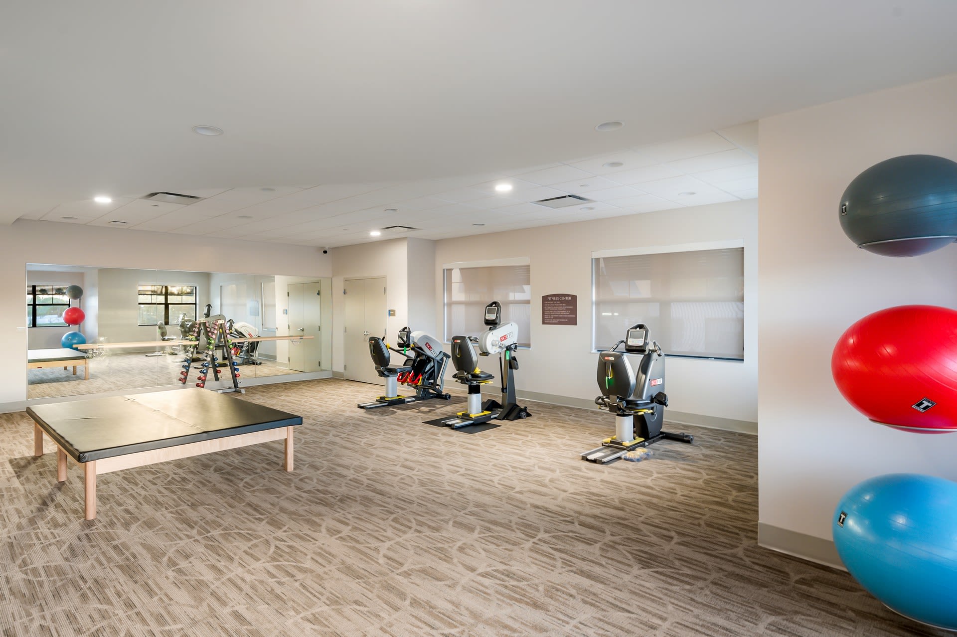 Fitness center with classes at Inspired Living Royal Palm Beach in Royal Palm Beach, Florida