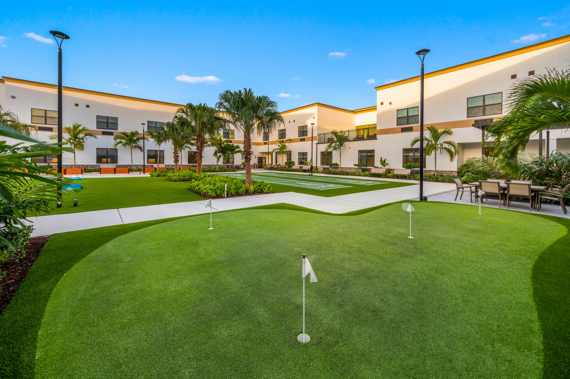 Sunset courtyard of Inspired Living Royal Palm Beach in Royal Palm Beach, Florida