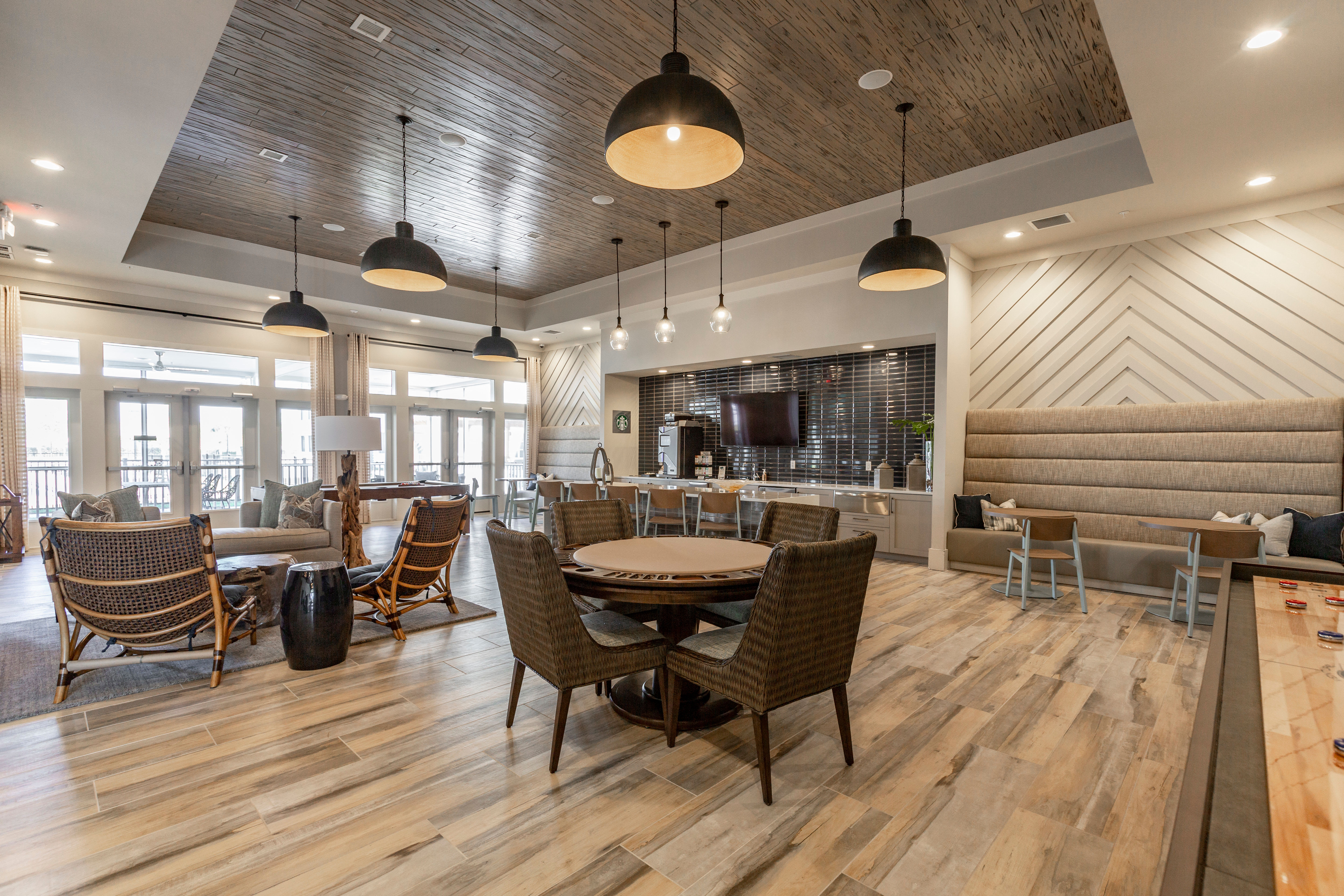 View of the living area from an open-concept model home's kitchen at Parc at Wesley Chapel in Wesley Chapel, Florida