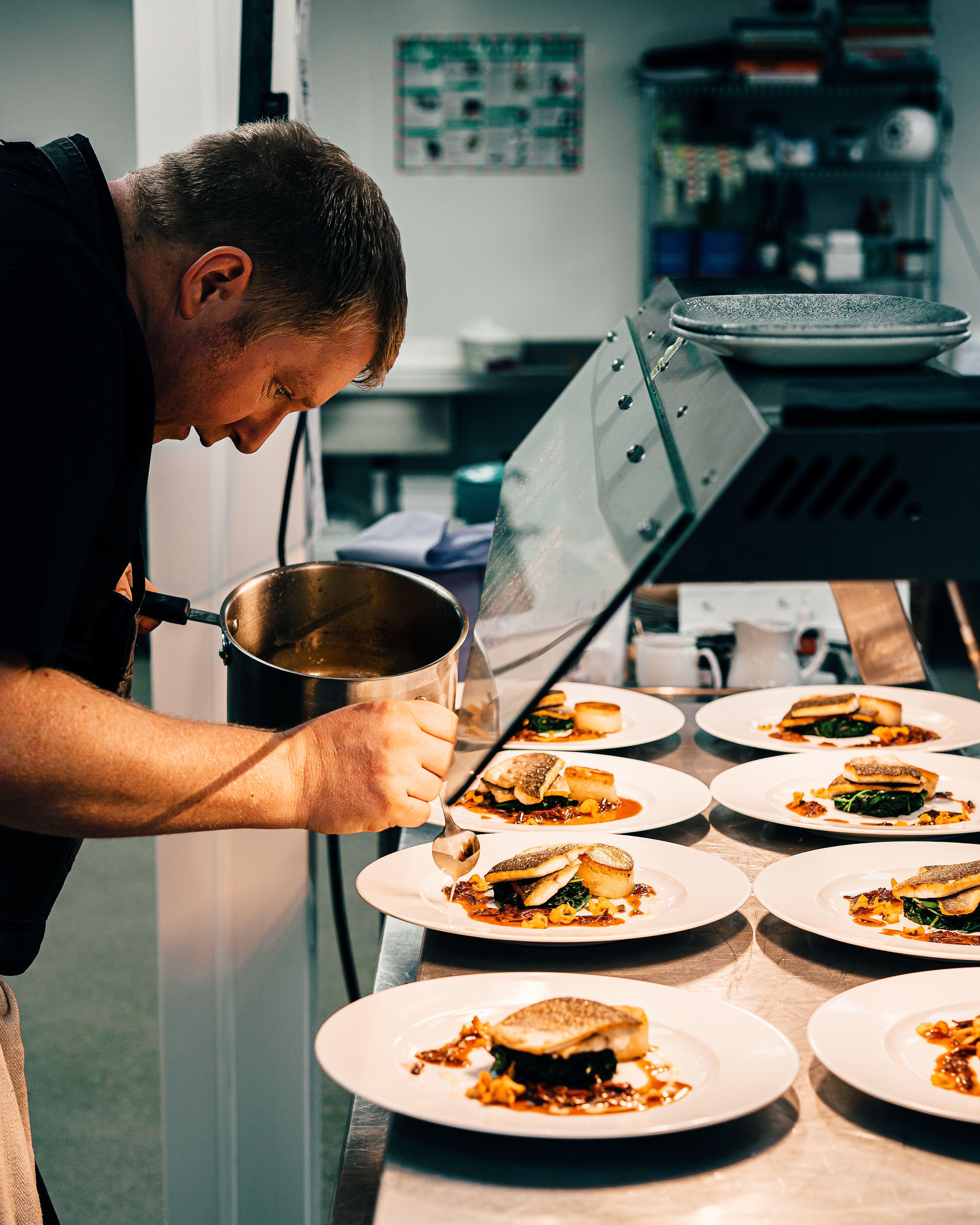 Dining staff prepares meals at Inspired Living Alpharetta in Alpharetta, Georgia