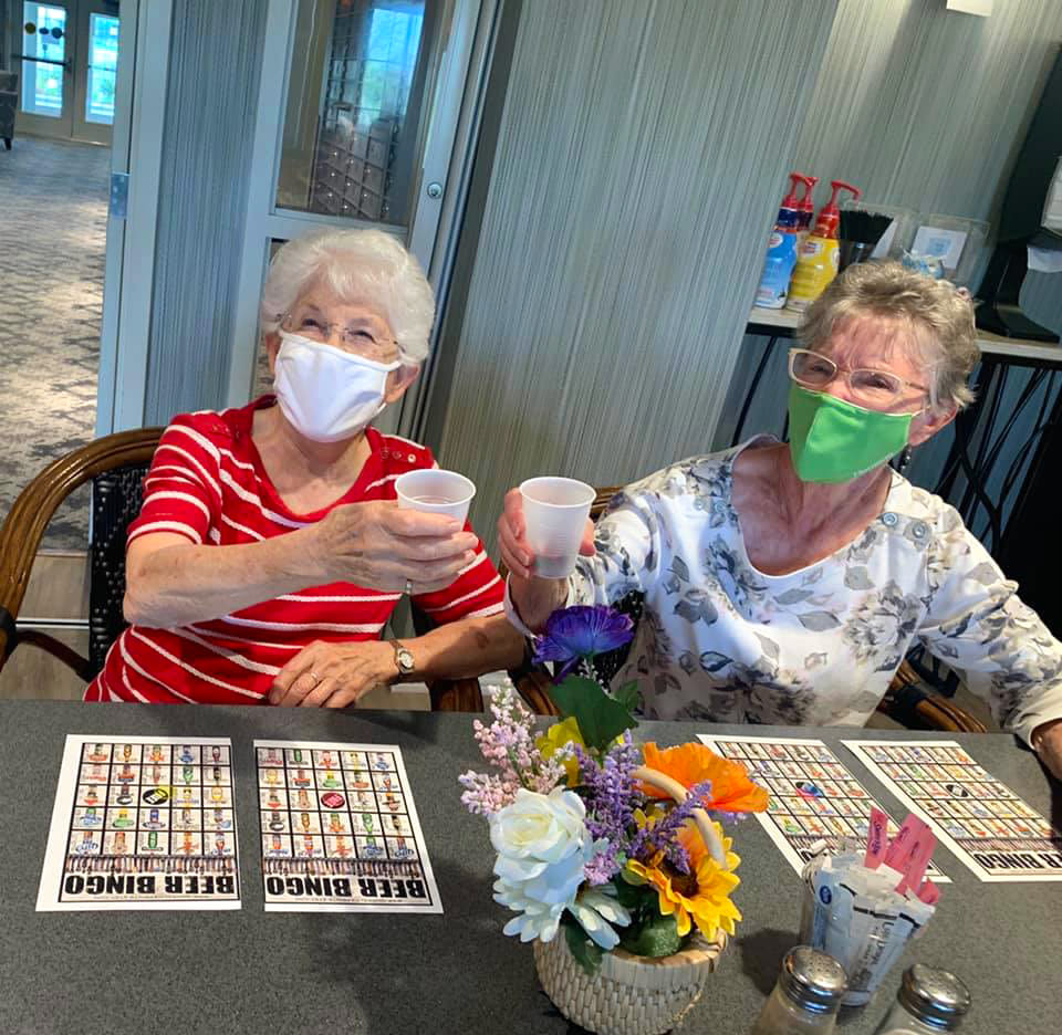 Residents playing bingo at Oxford Villa Active Senior Apartments in Wichita, Kansas