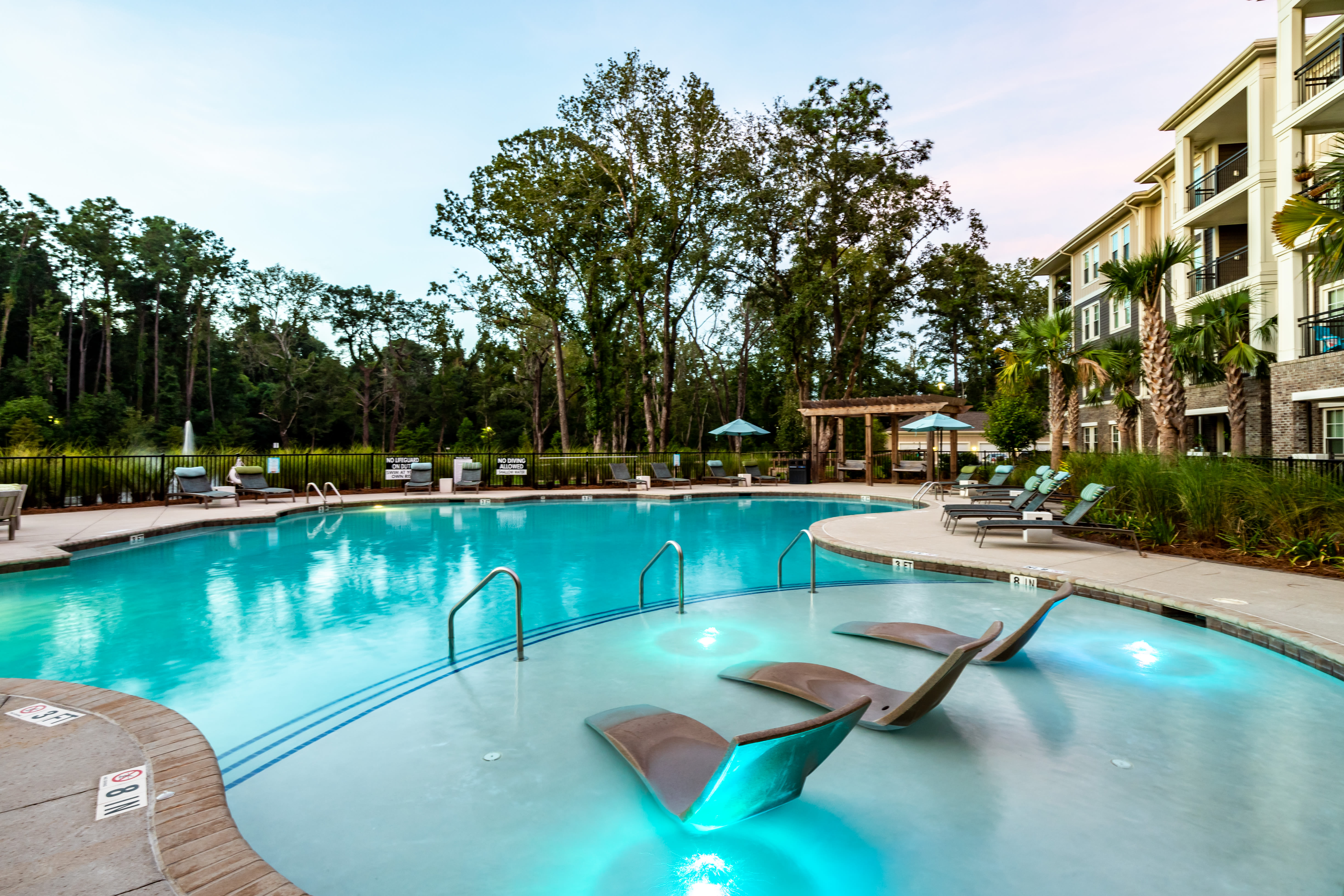 Pool with chairs at The Heyward in Charleston, South Carolina