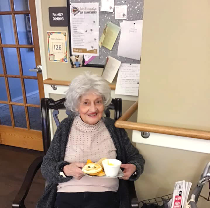 Resident with a breakfast plate at Canoe Brook Assisted Living & Memory Care in Catoosa, Oklahoma