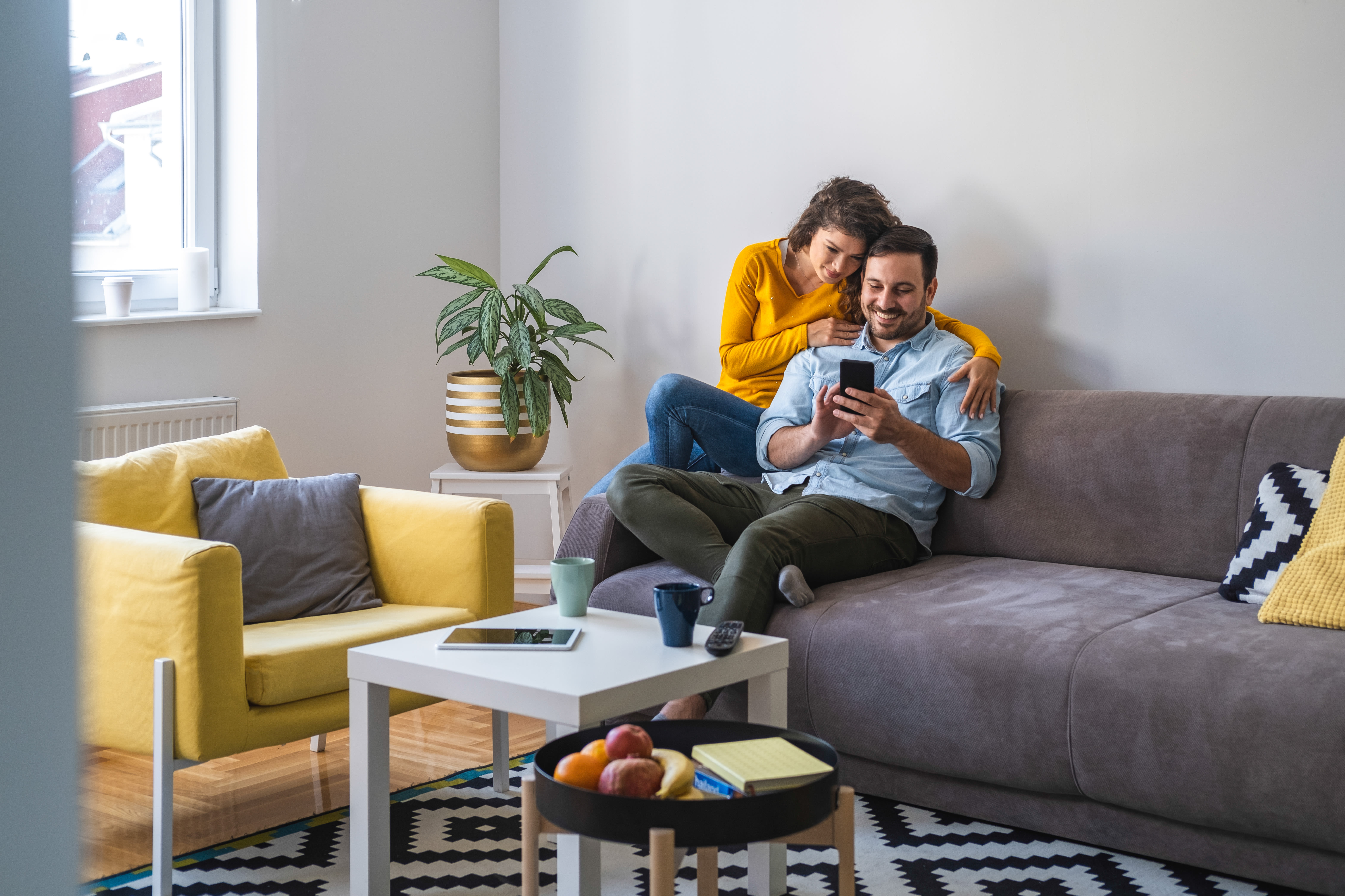 Couple relaxing together in the living room at The 450 in Lombard, Illinois