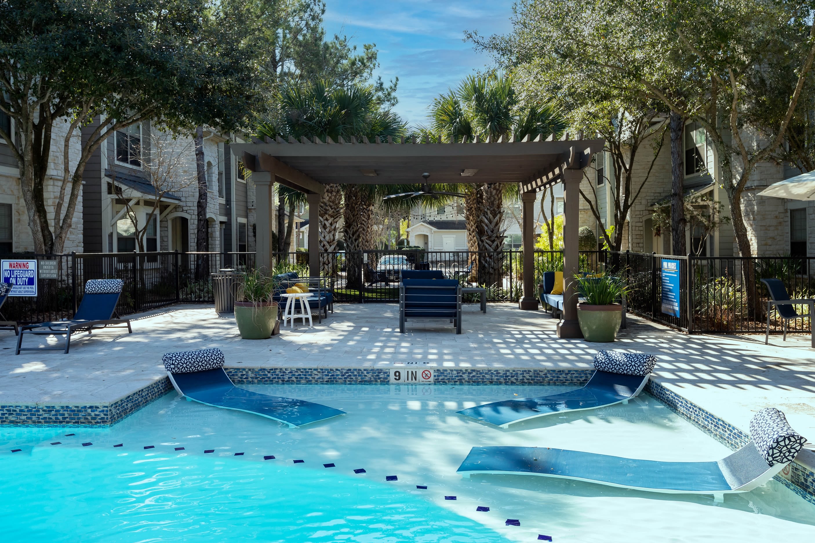 Resort style pool with sundeck at Lakefront Villas