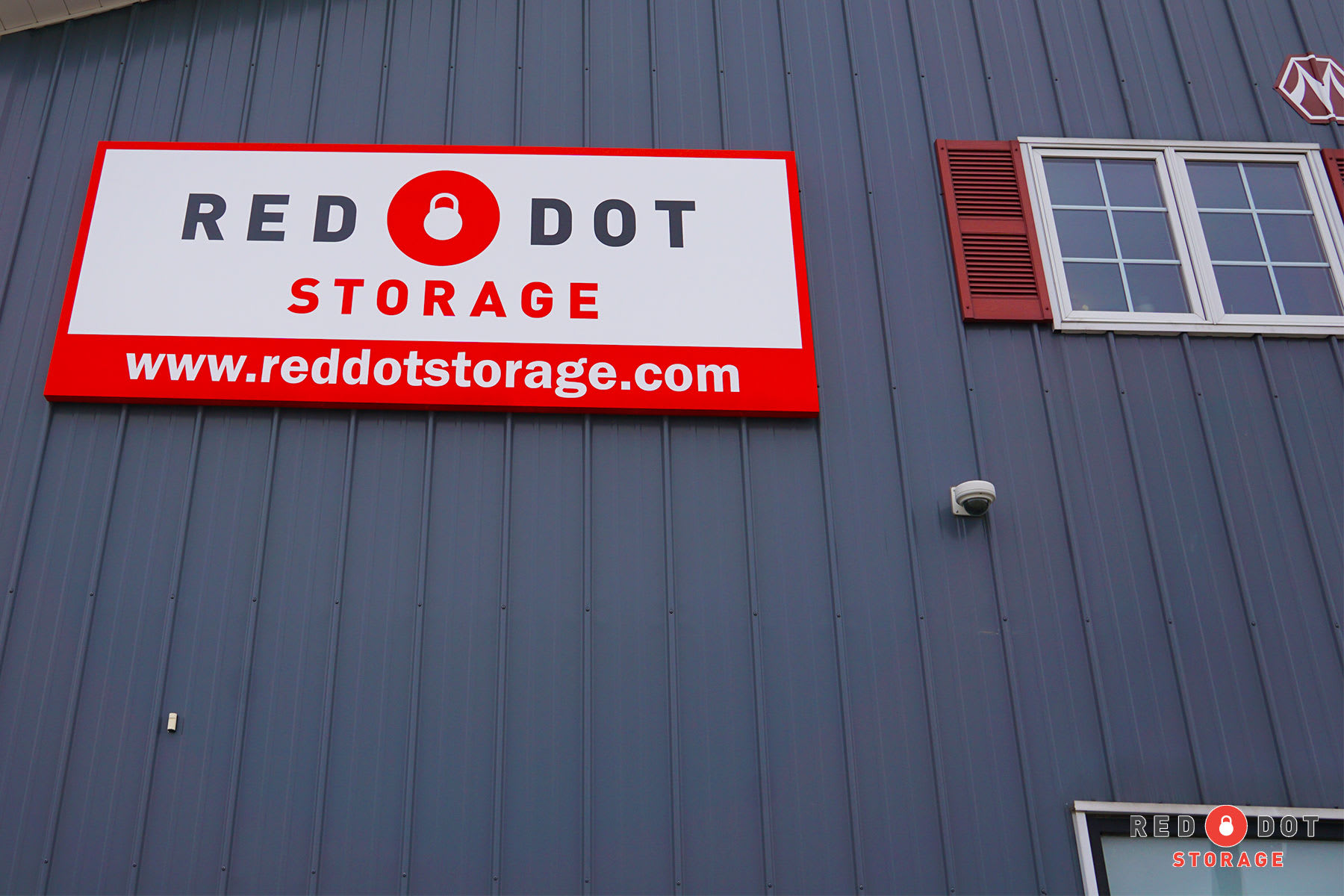 Red Dot sign on side of building at Red Dot Storage in Charlestown, Indiana