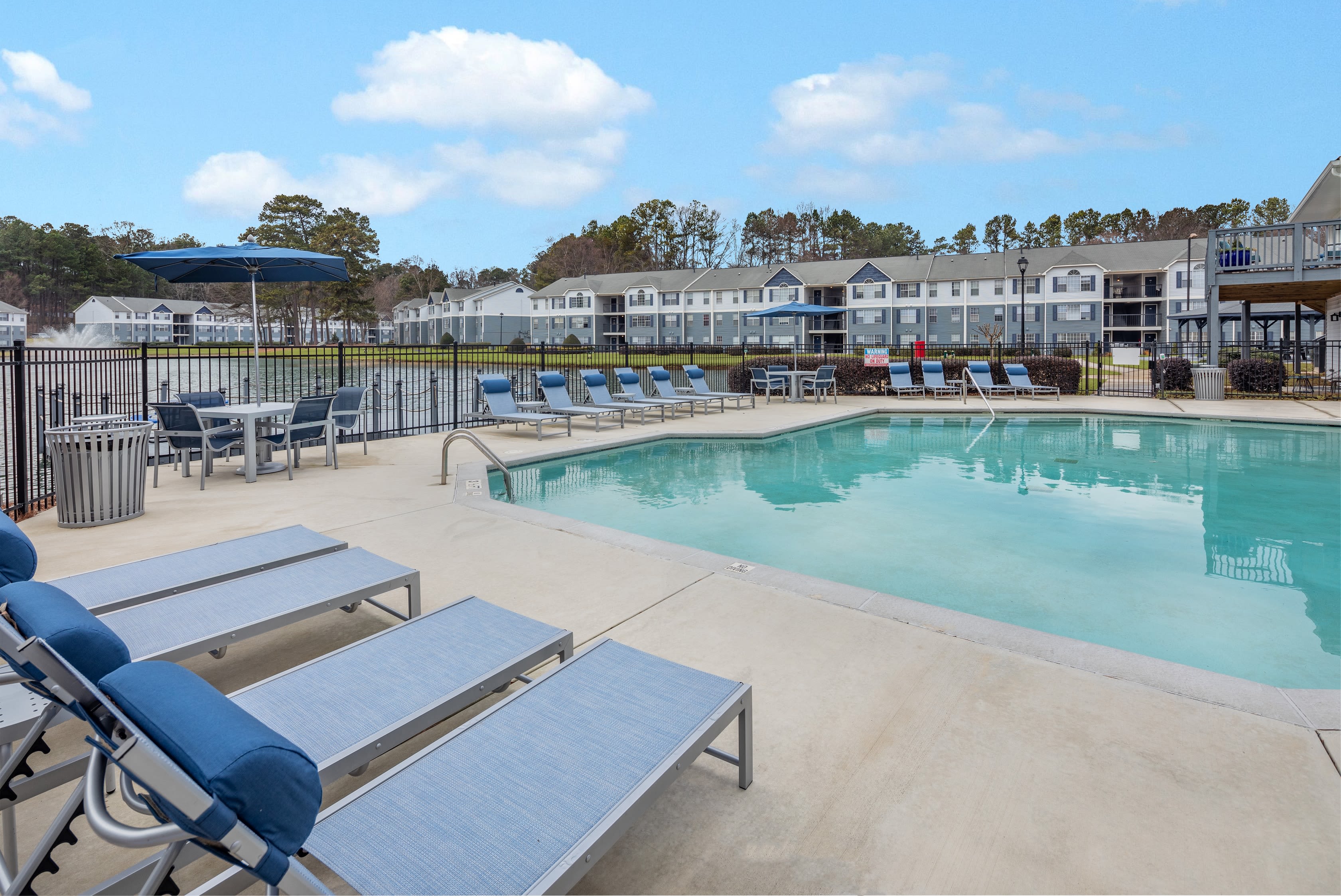 Expansive covered gazebo and fire pit area near the lake at The Bentley at Marietta in Marietta, Georgia