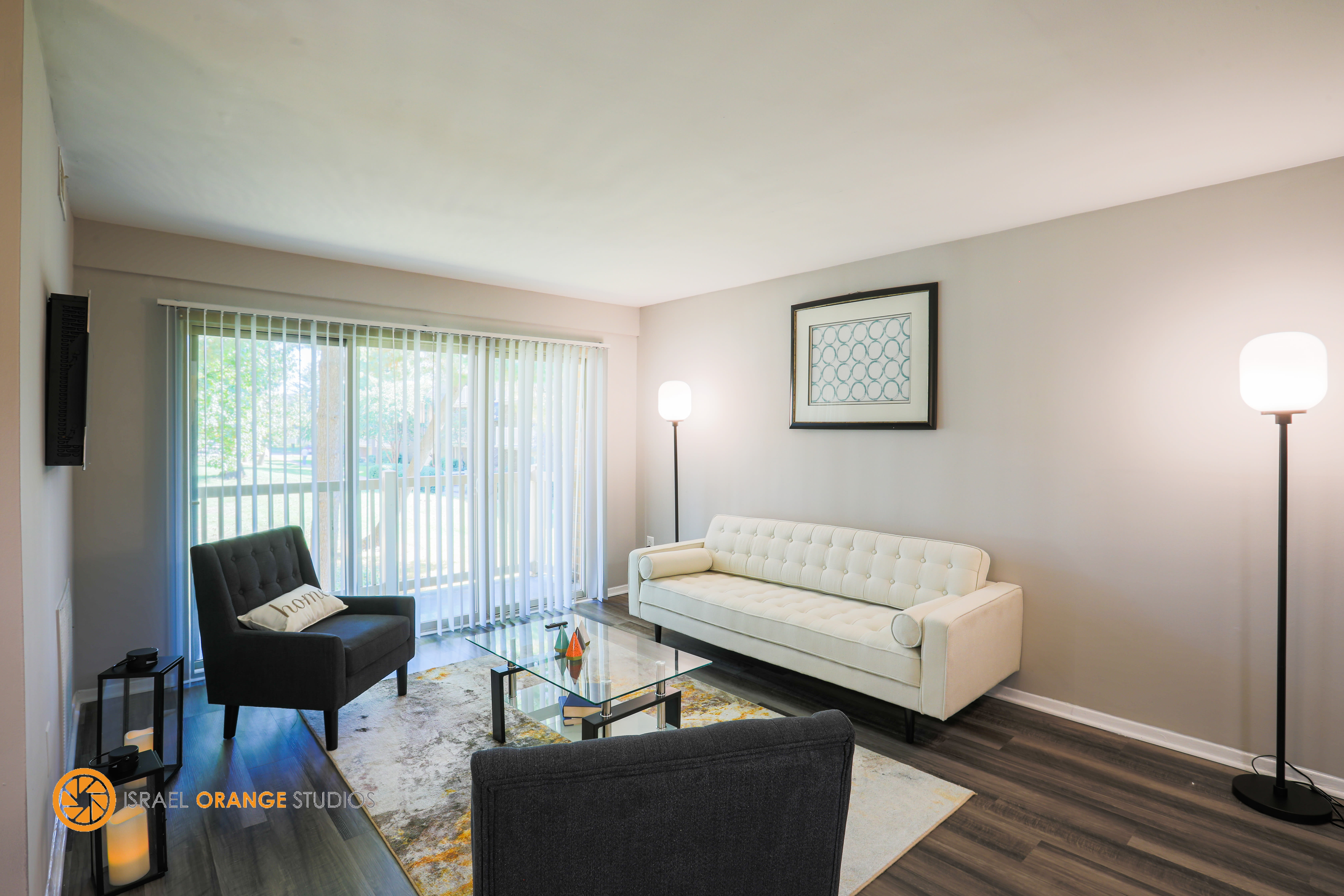 Cozy living room with couches next to window at The Glendale Residence in Lanham, Maryland