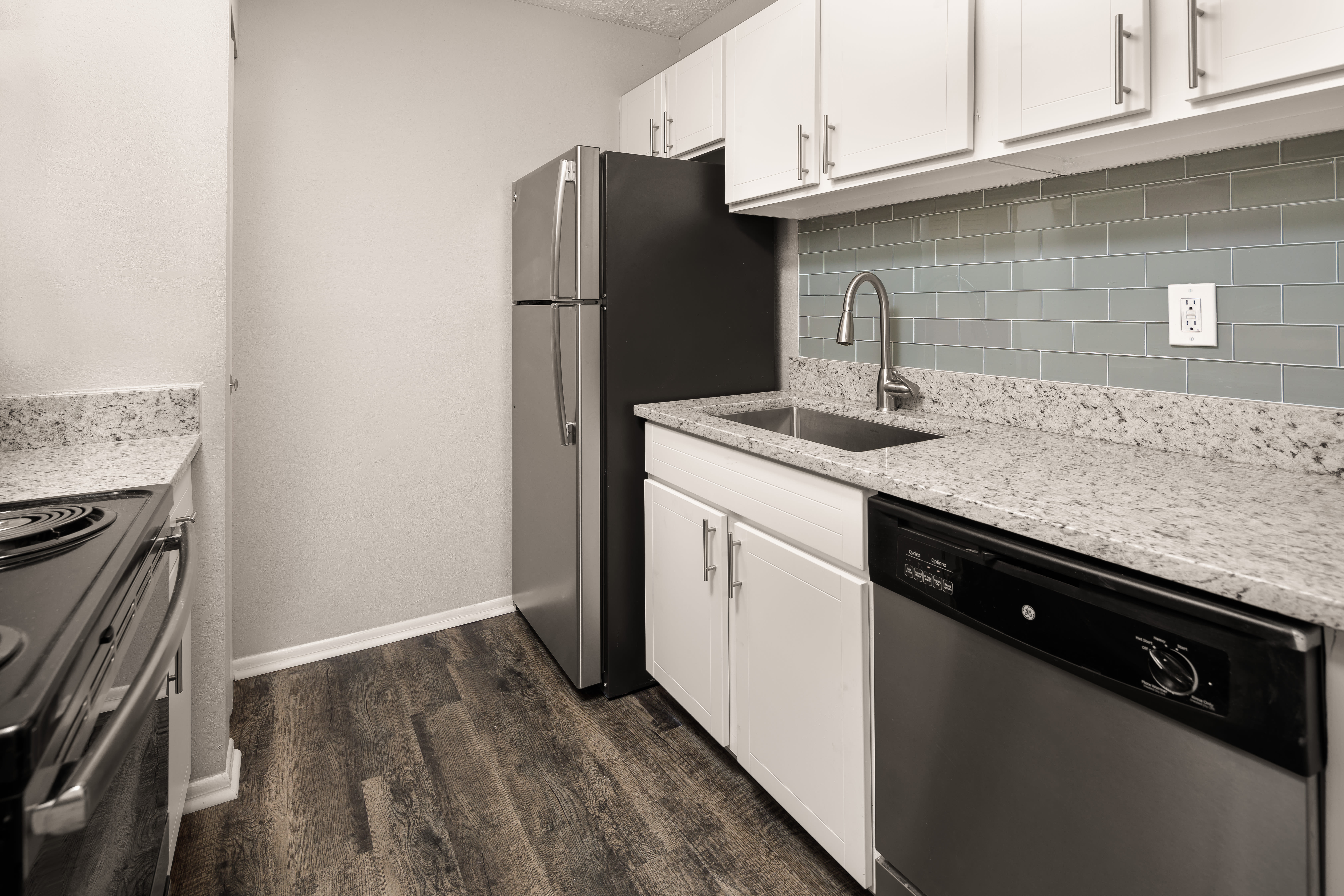 An apartment kitchen with new appliances at The Franklin in Marietta, GA
