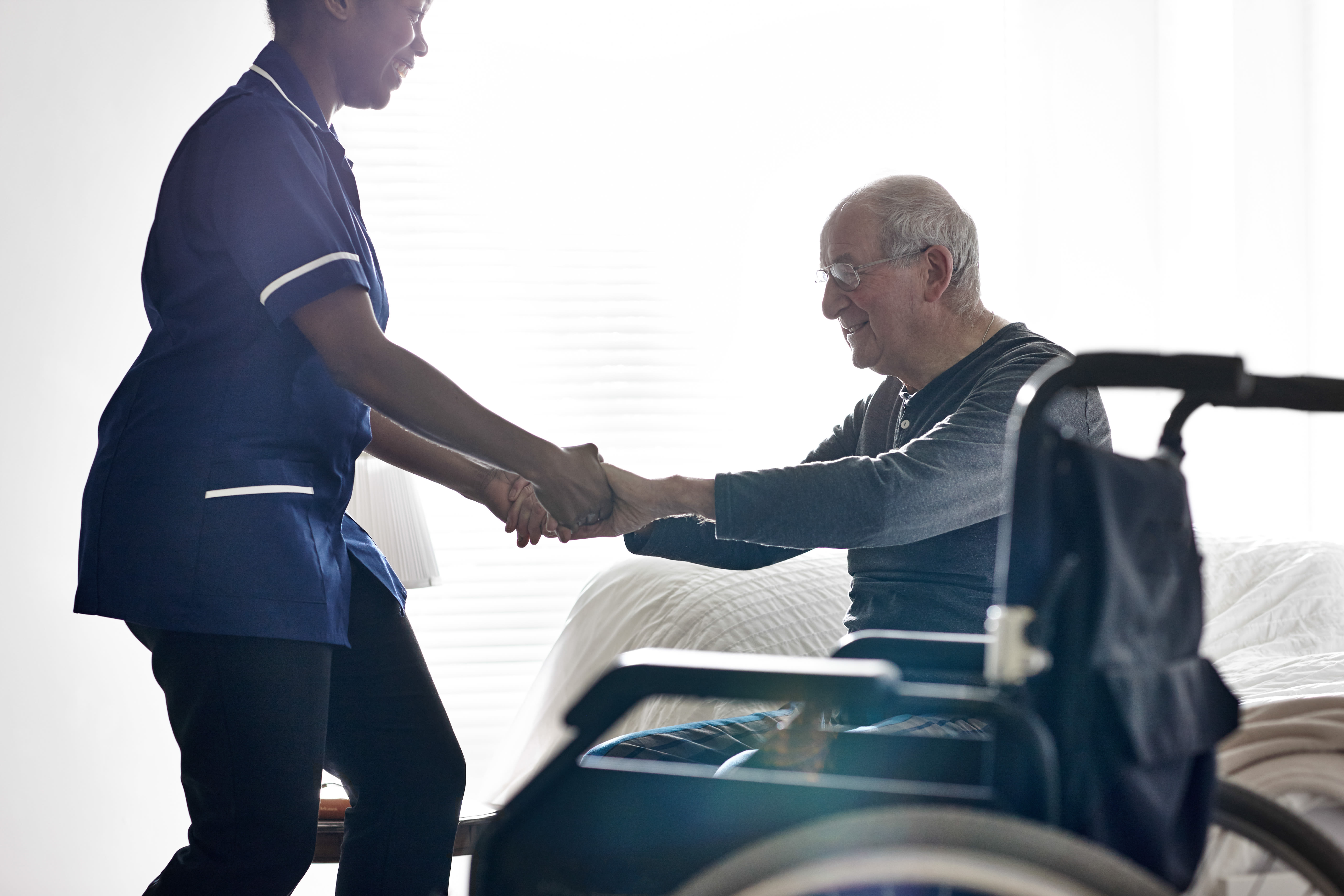 Caretaker assisting resident at York Gardens in Edina, MN