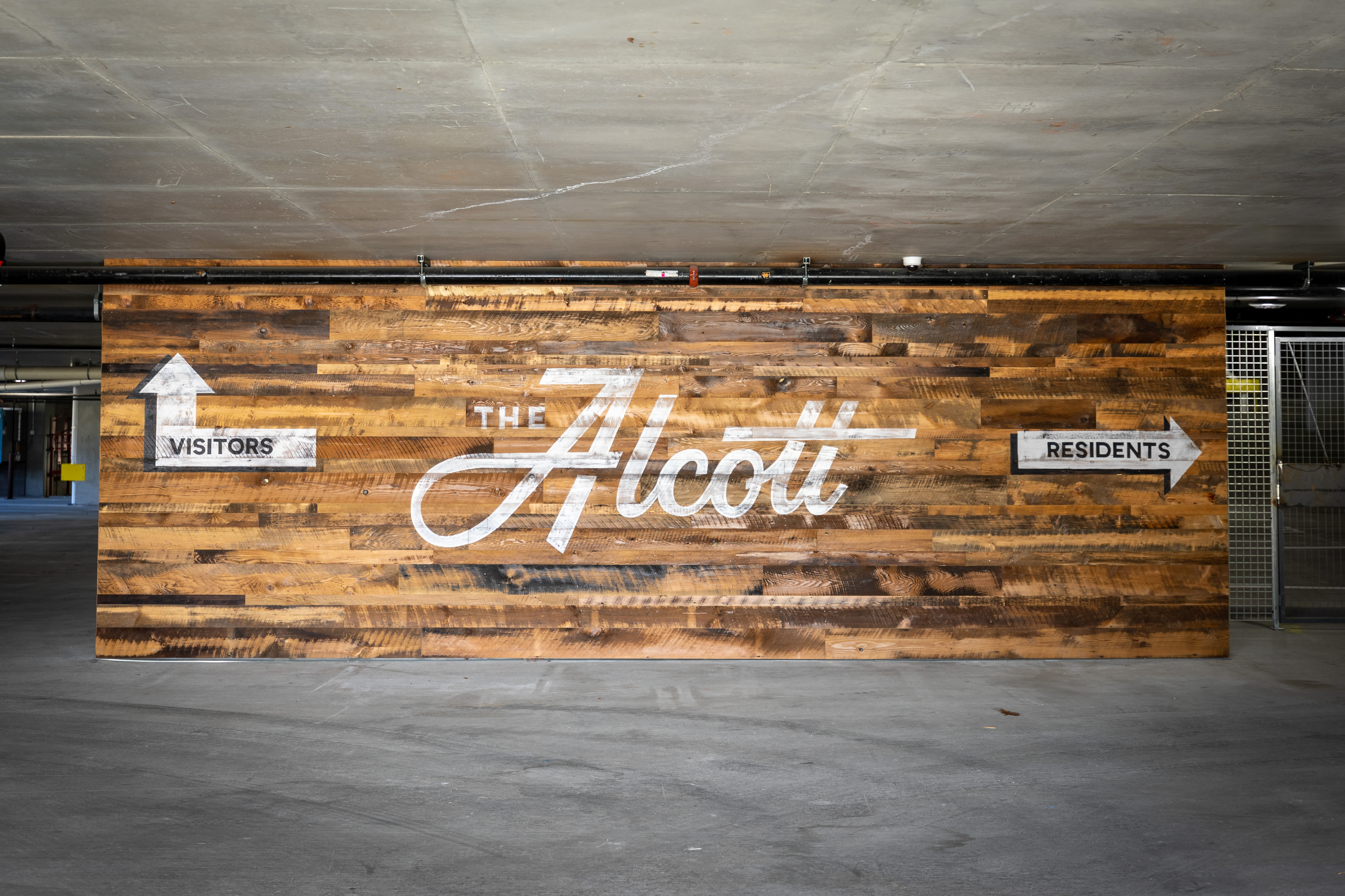 The Alcott sign on wood in Downtown Denver, Colorado