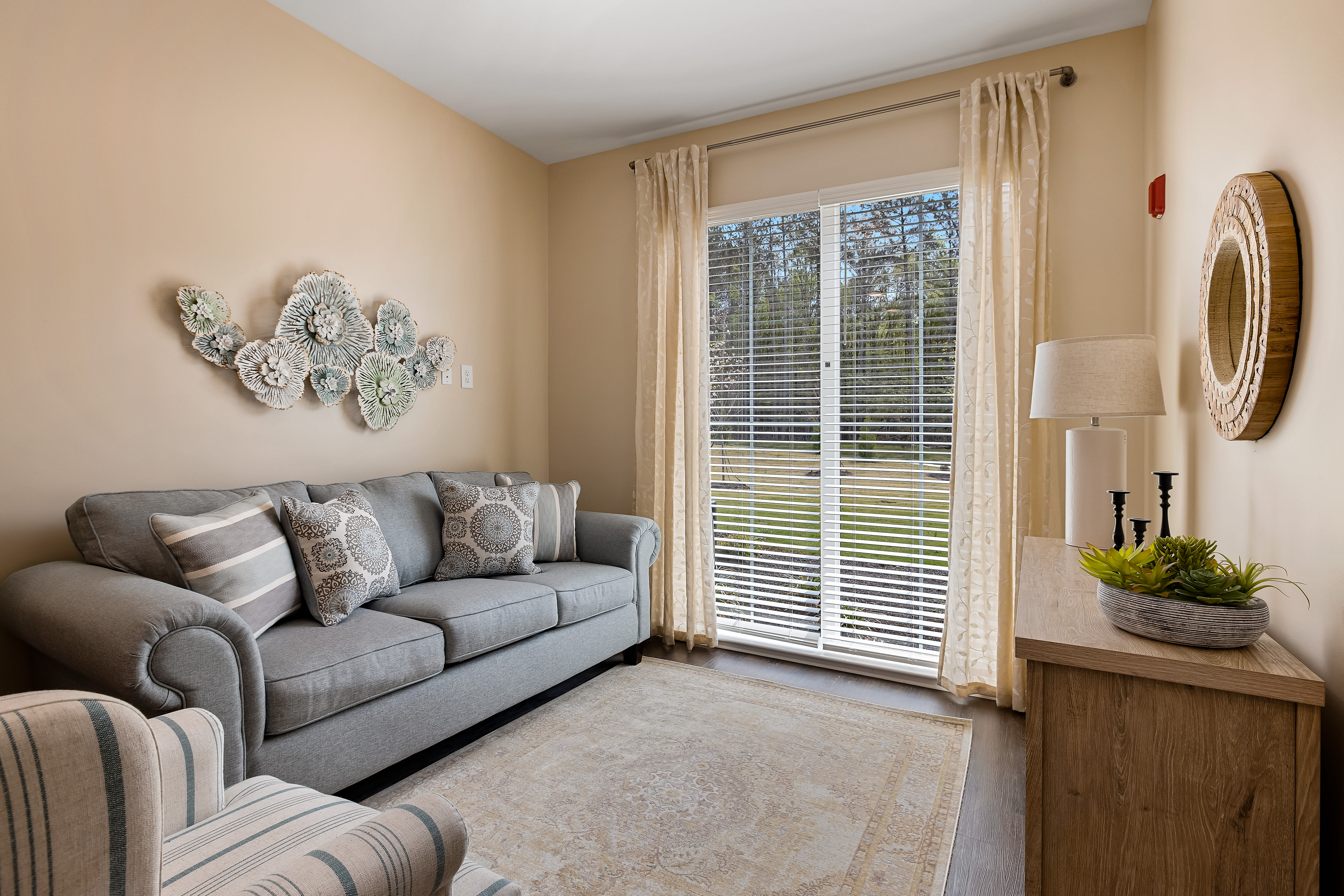 Warm furnished bedroom with a scenic view at The Claiborne at Newnan Lakes in Newnan, GA