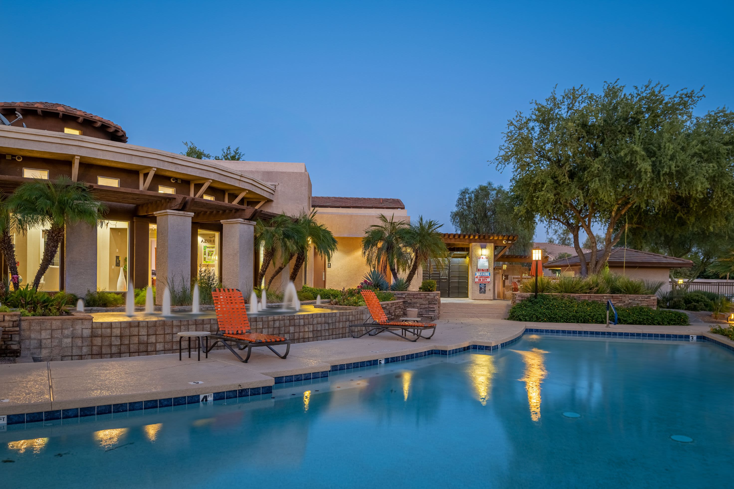 Resort-style pool with sun chairs at Azure Creek in Cave Creek, Arizona
