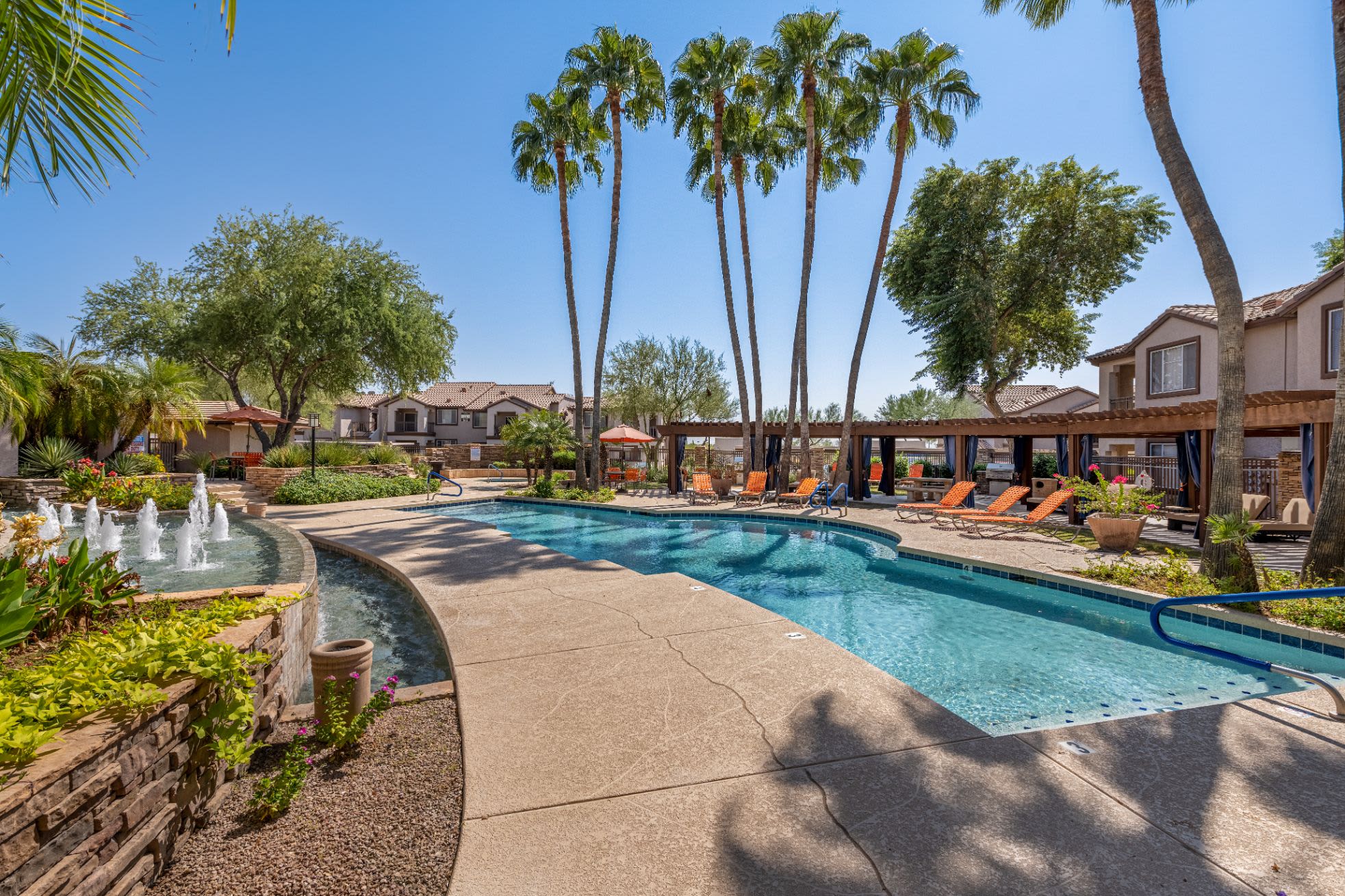 Swimming pool surrounded by vibrant landscaping Azure Creek in Cave Creek, Arizona
