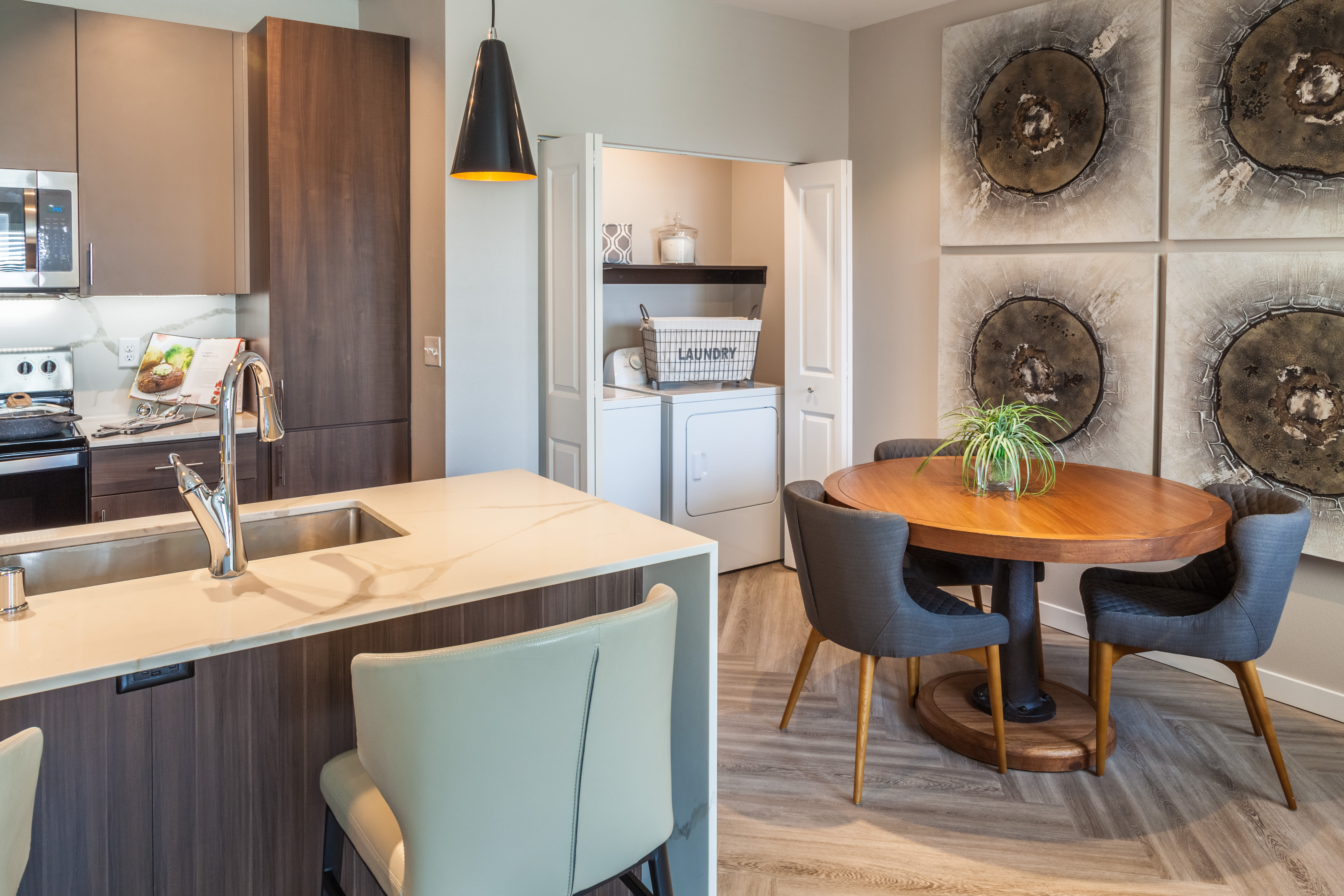 Modern decor in a model home's dining area at Olympus Alameda in Albuquerque, New Mexico