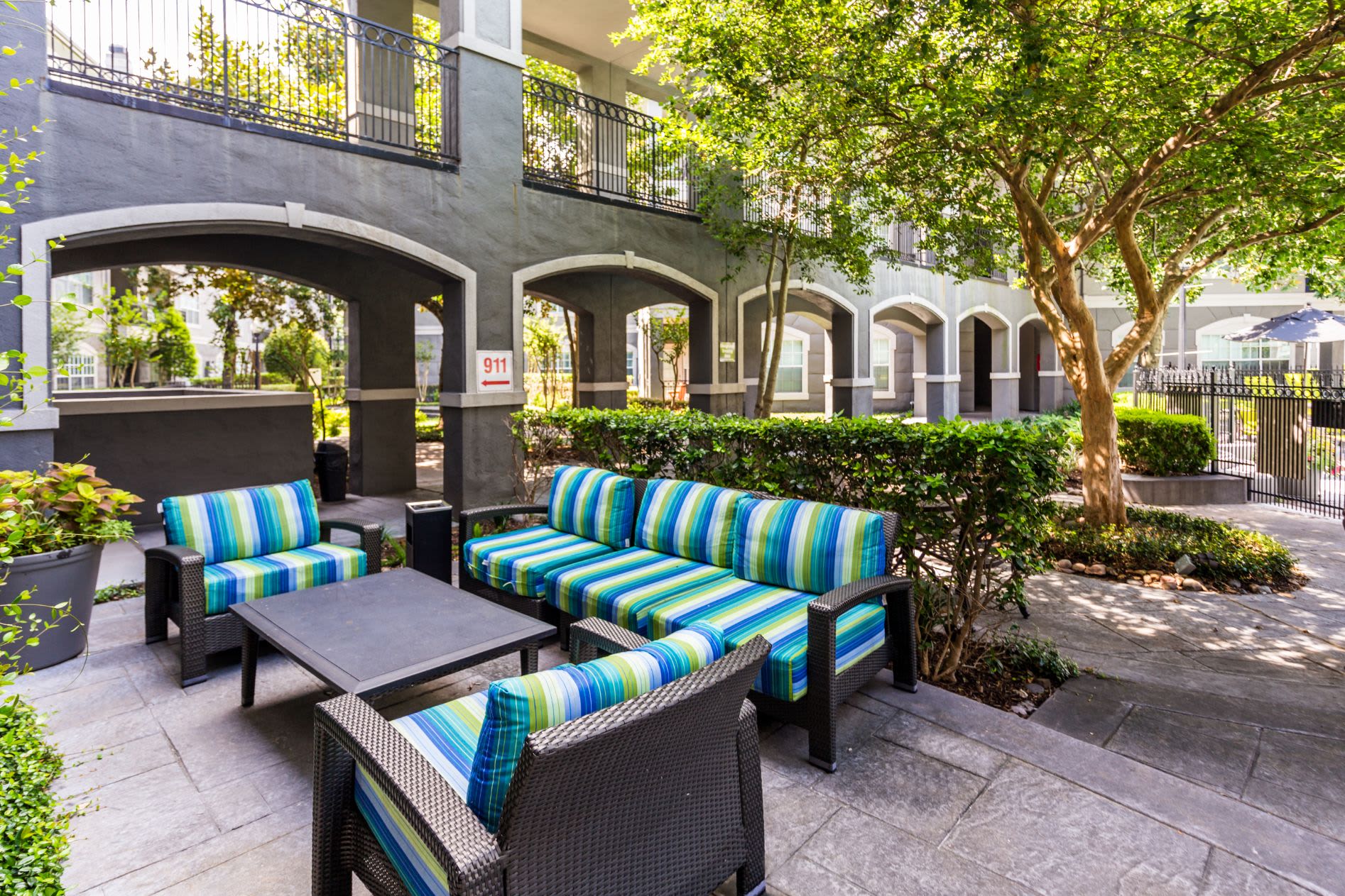 Couch and chairs on an outdoor patio at Marquis at Tanglewood in Houston, Texas