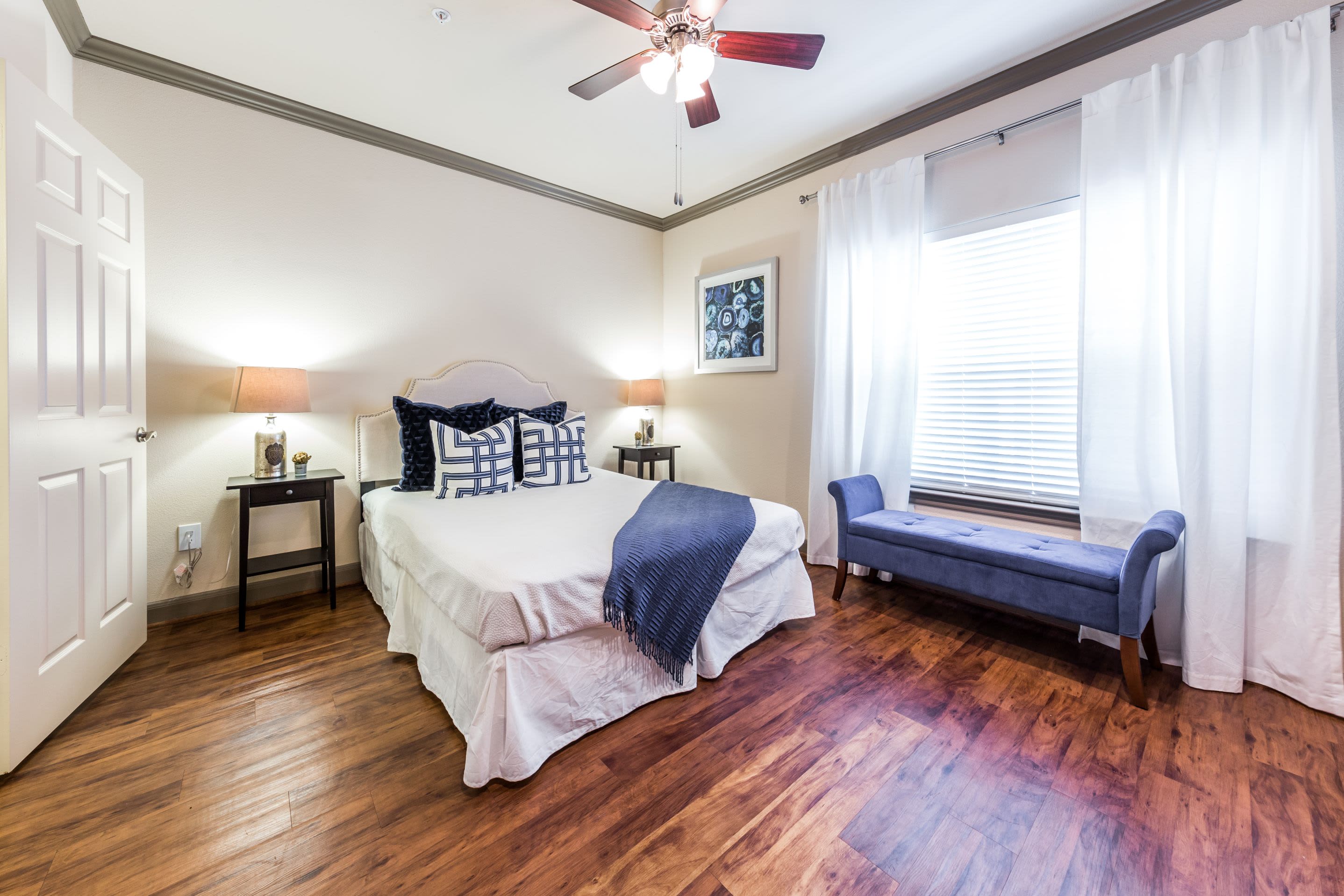 Bedroom with wood style flooring at Marquis at Tanglewood in Houston, Texas 