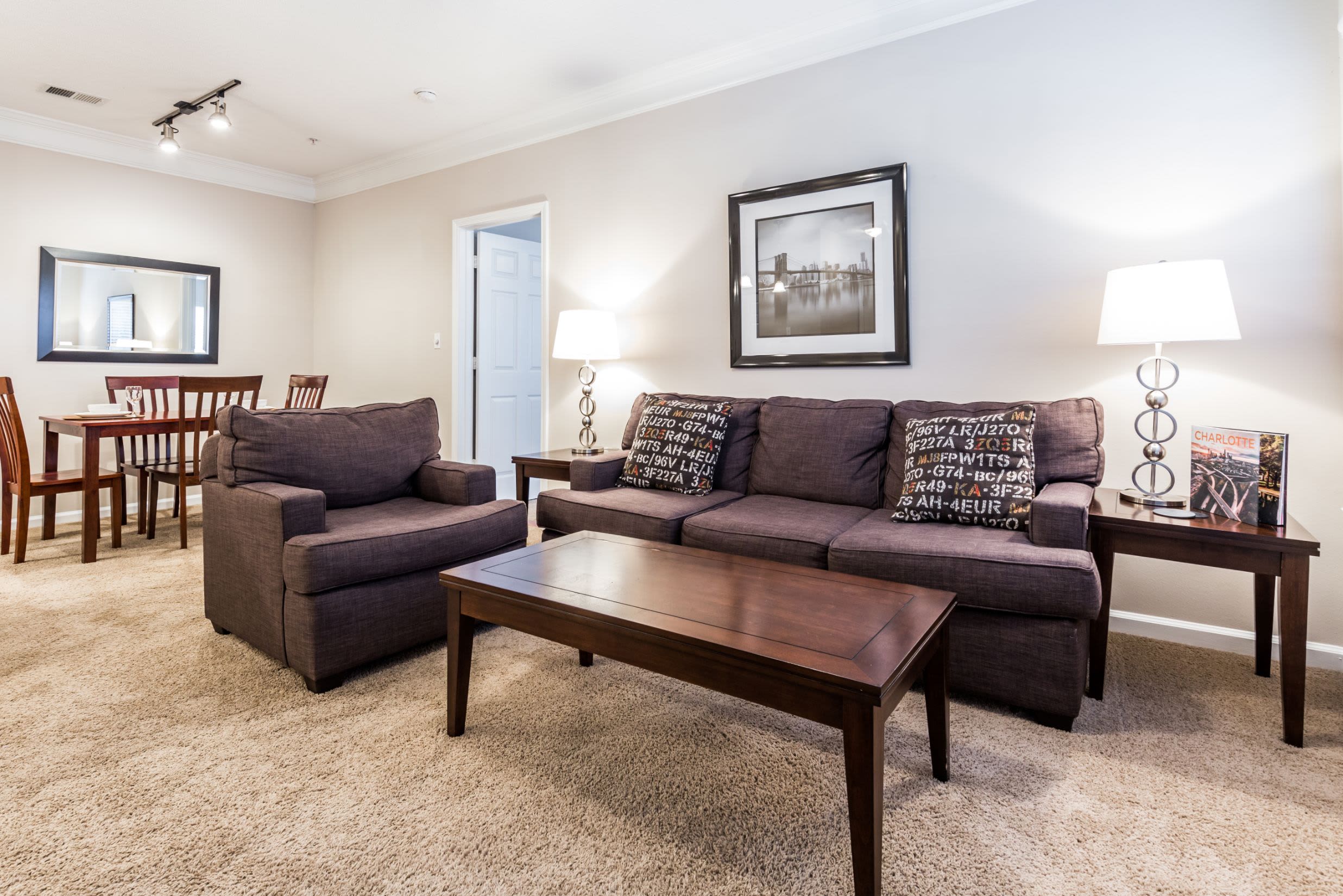 Living area with carpeted floors at The Preserve at Ballantyne Commons in Charlotte, North Carolina