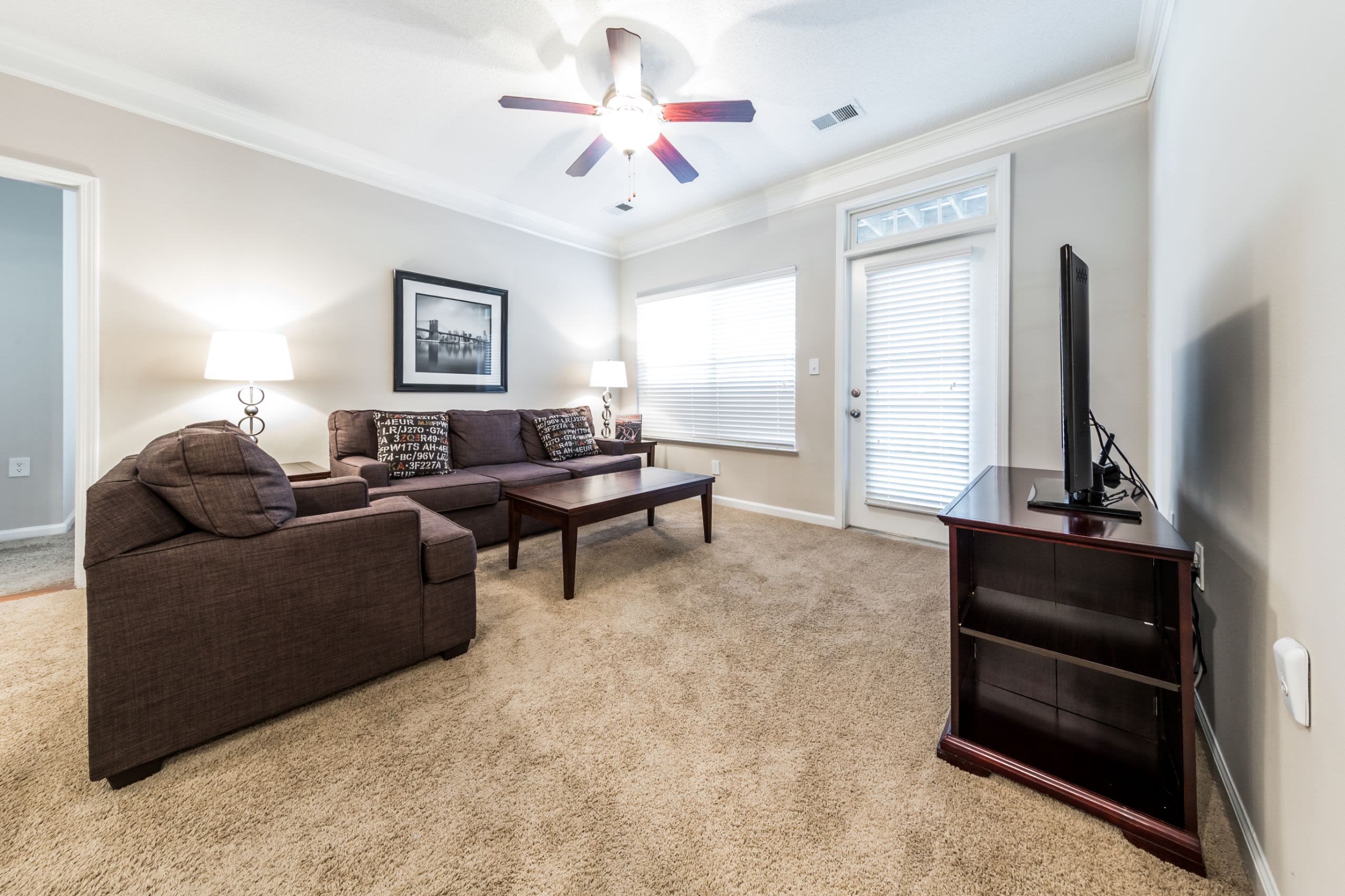 Living area with ceiling fan at The Preserve at Ballantyne Commons in Charlotte, North Carolina