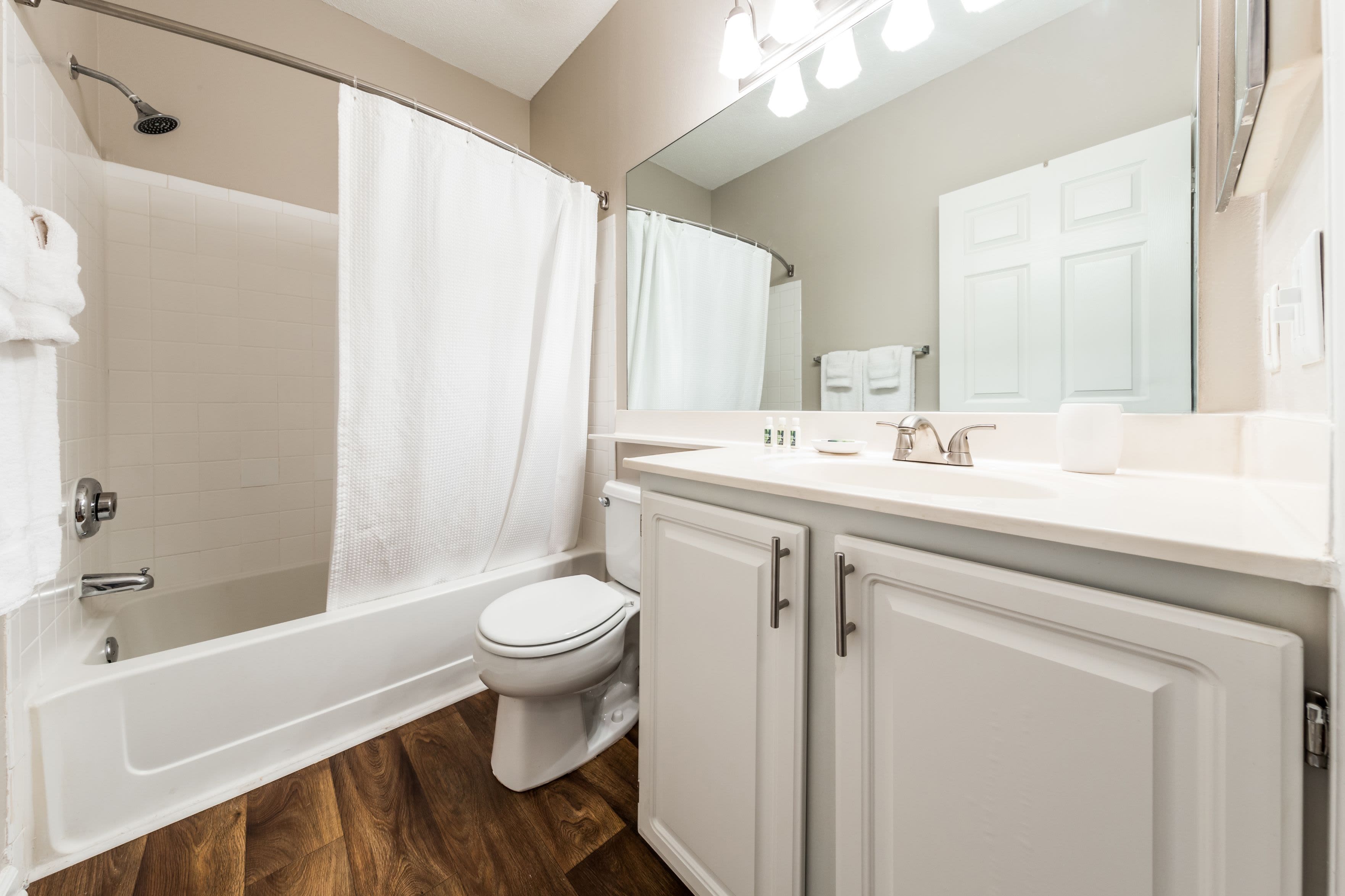 Bathroom with white cabinets and counters at The Preserve at Ballantyne Commons in Charlotte, North Carolina