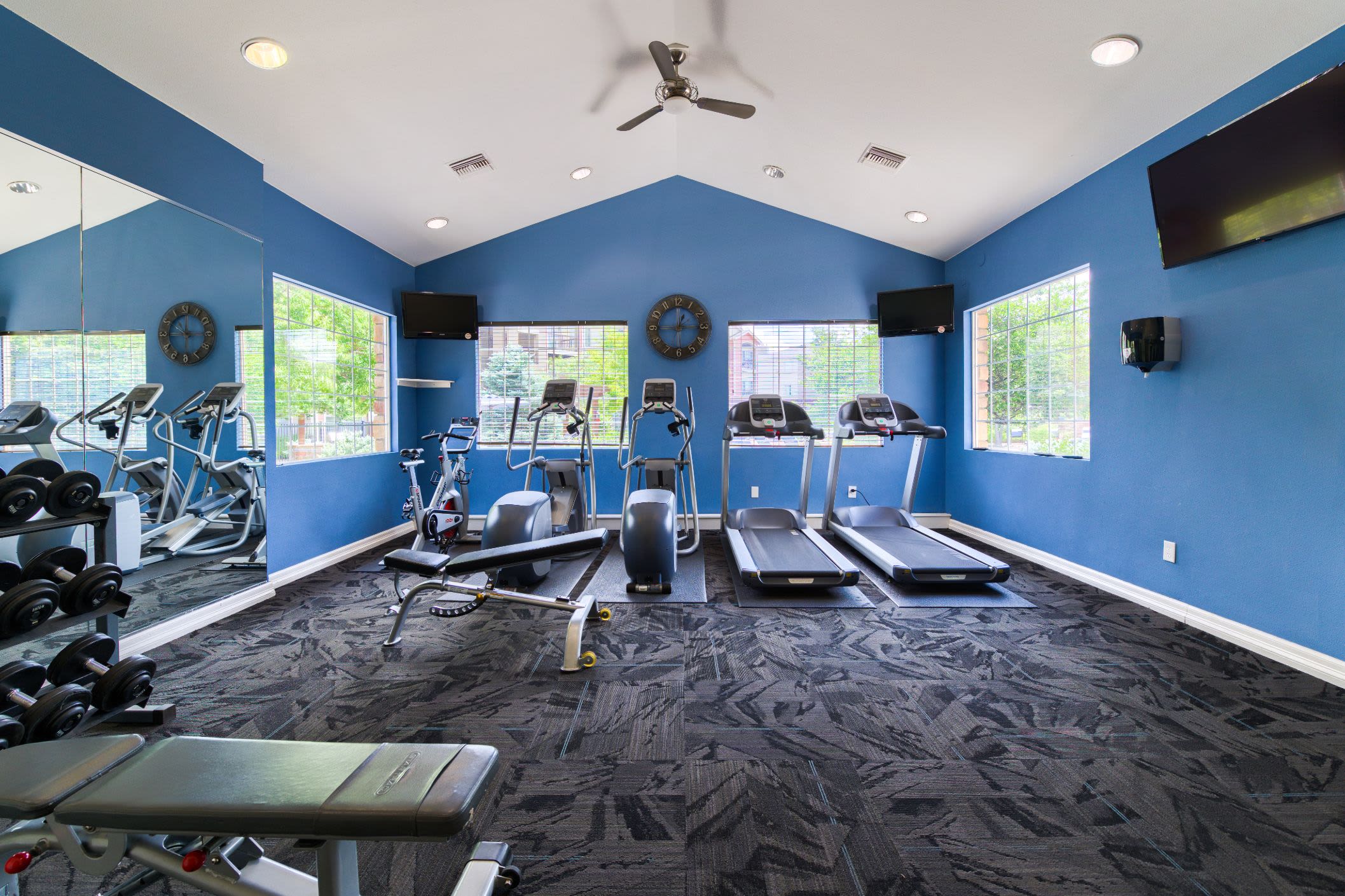 Treadmills in the fitness center at Whisper Creek Apartment Homes in Lakewood, Colorado