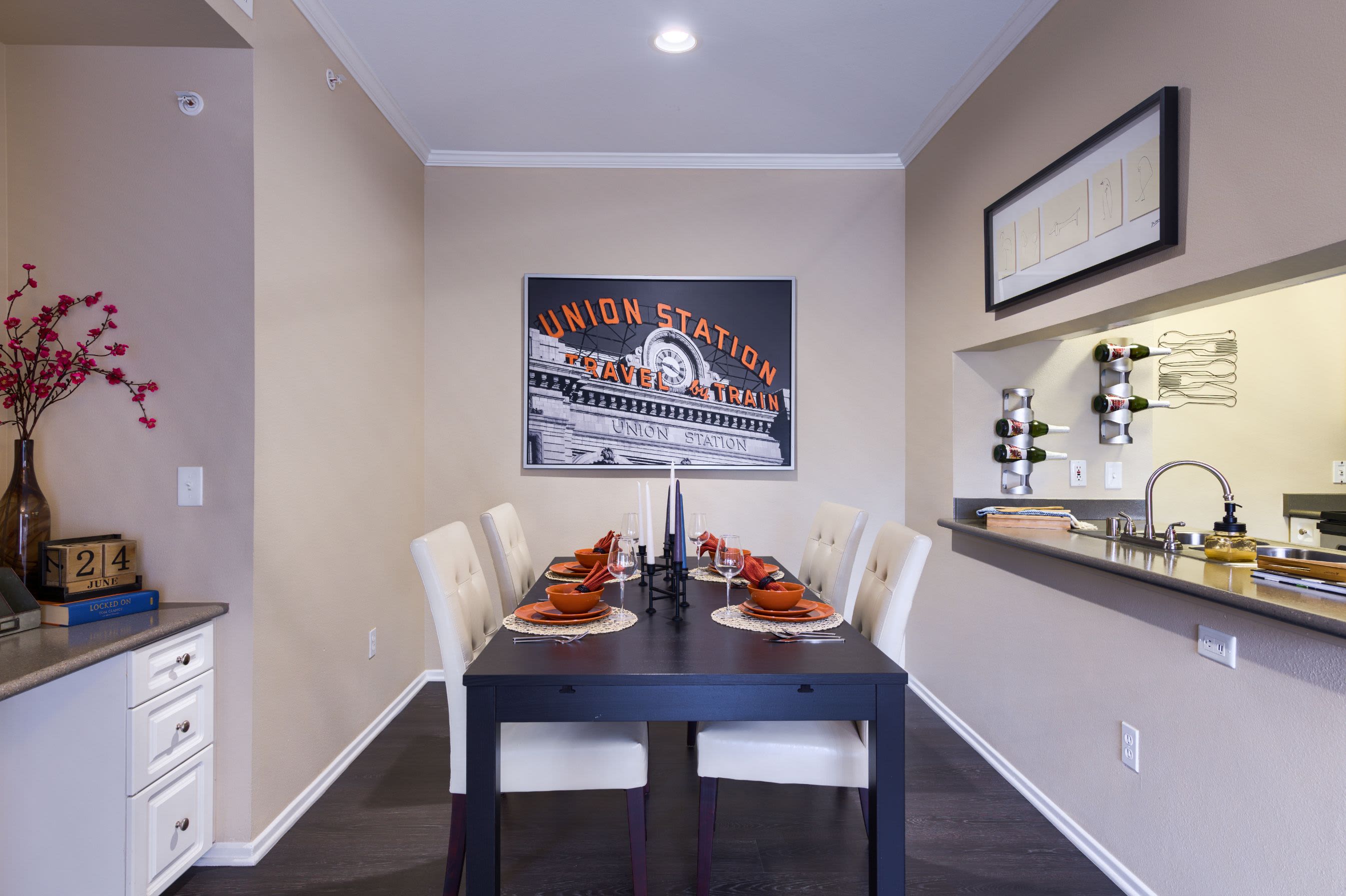 Dining room with neatly made table at Whisper Creek Apartment Homes in Lakewood, Colorado