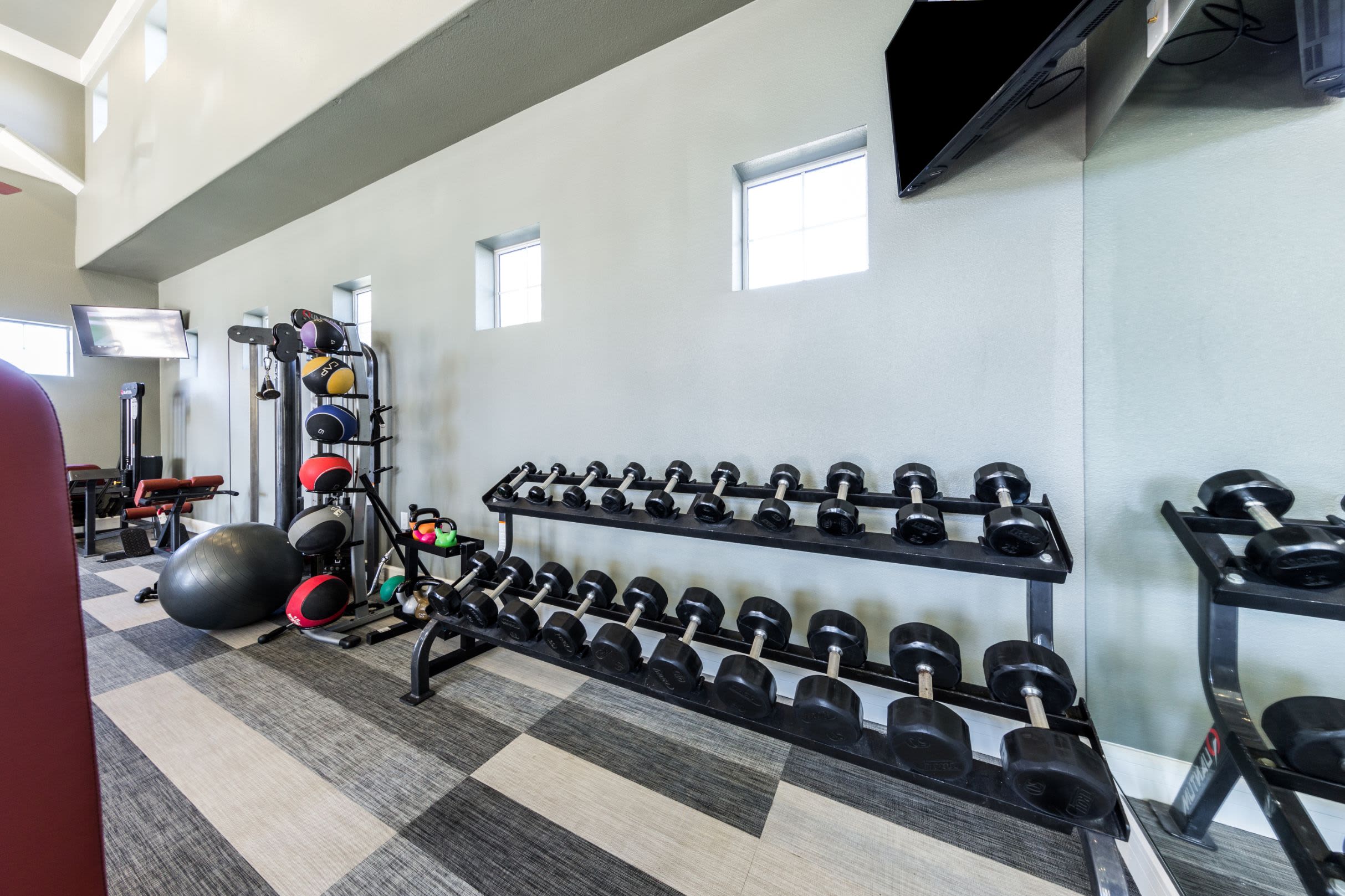 Rack of weights in fitness center at Marquis at The Woodlands in Spring, Texas