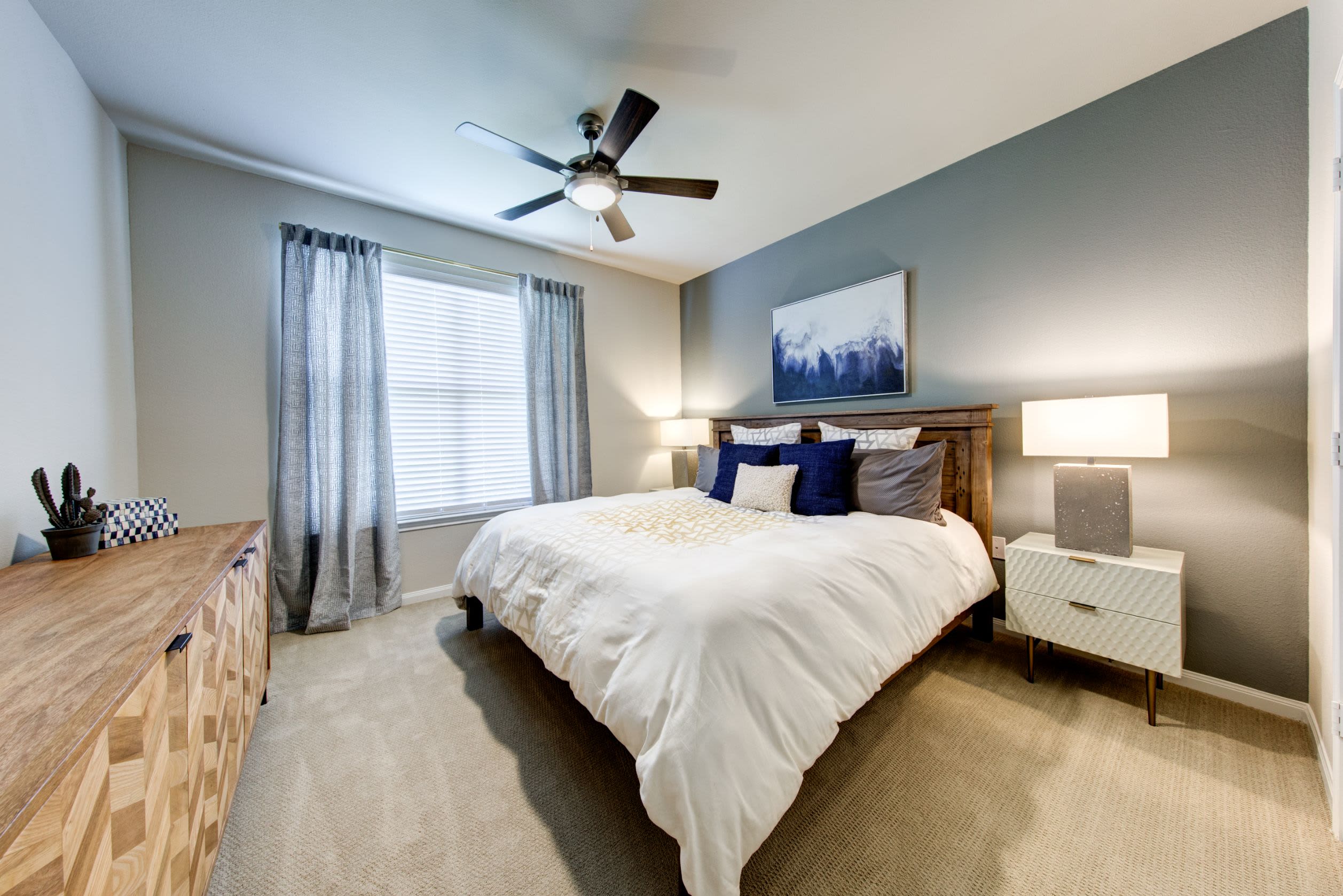 Bedroom with wood style flooring at Marquis at The Woodlands in Spring, Texas