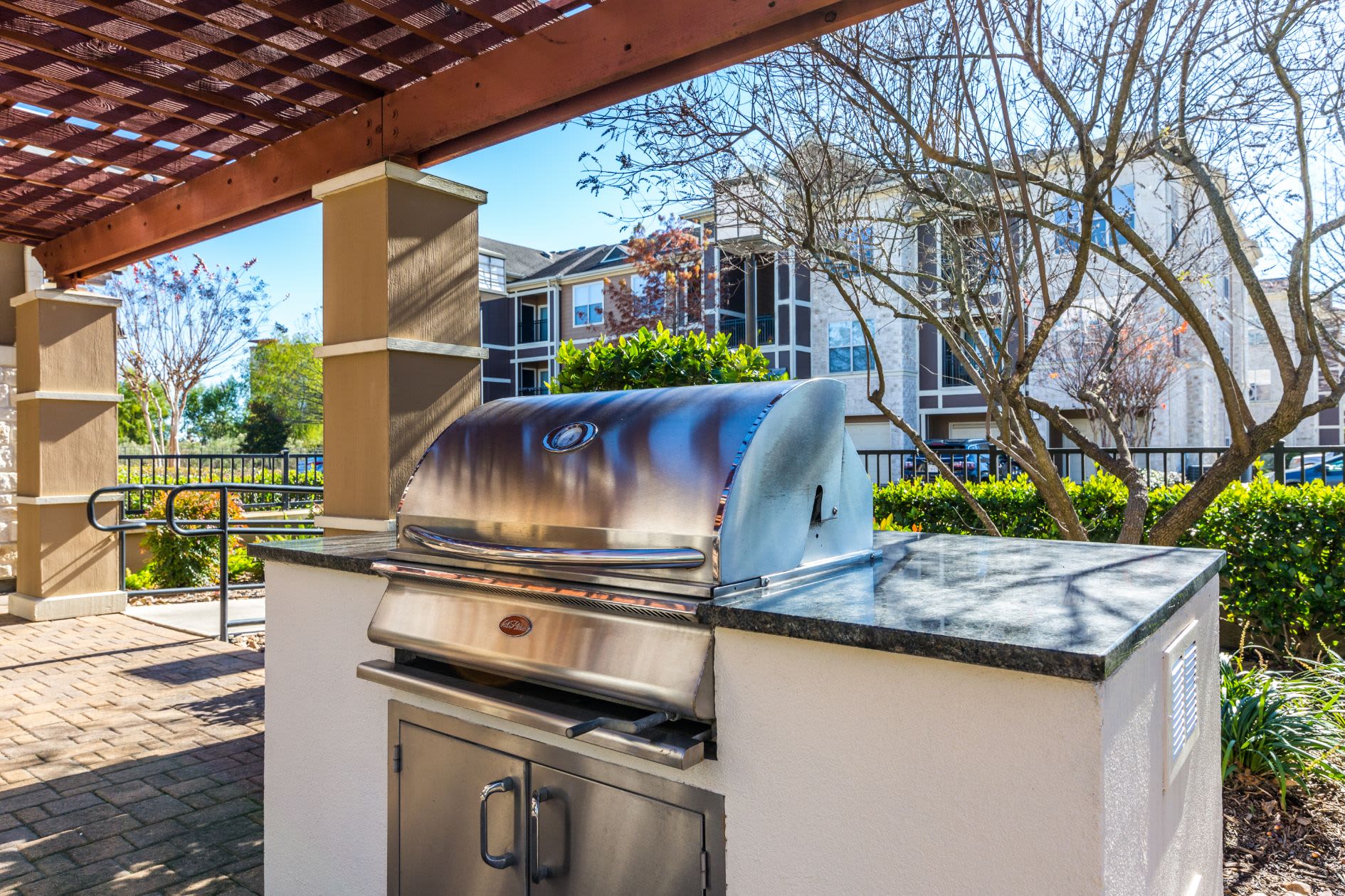 Outdoor grill for residents at Marquis at The Woodlands in Spring, Texas