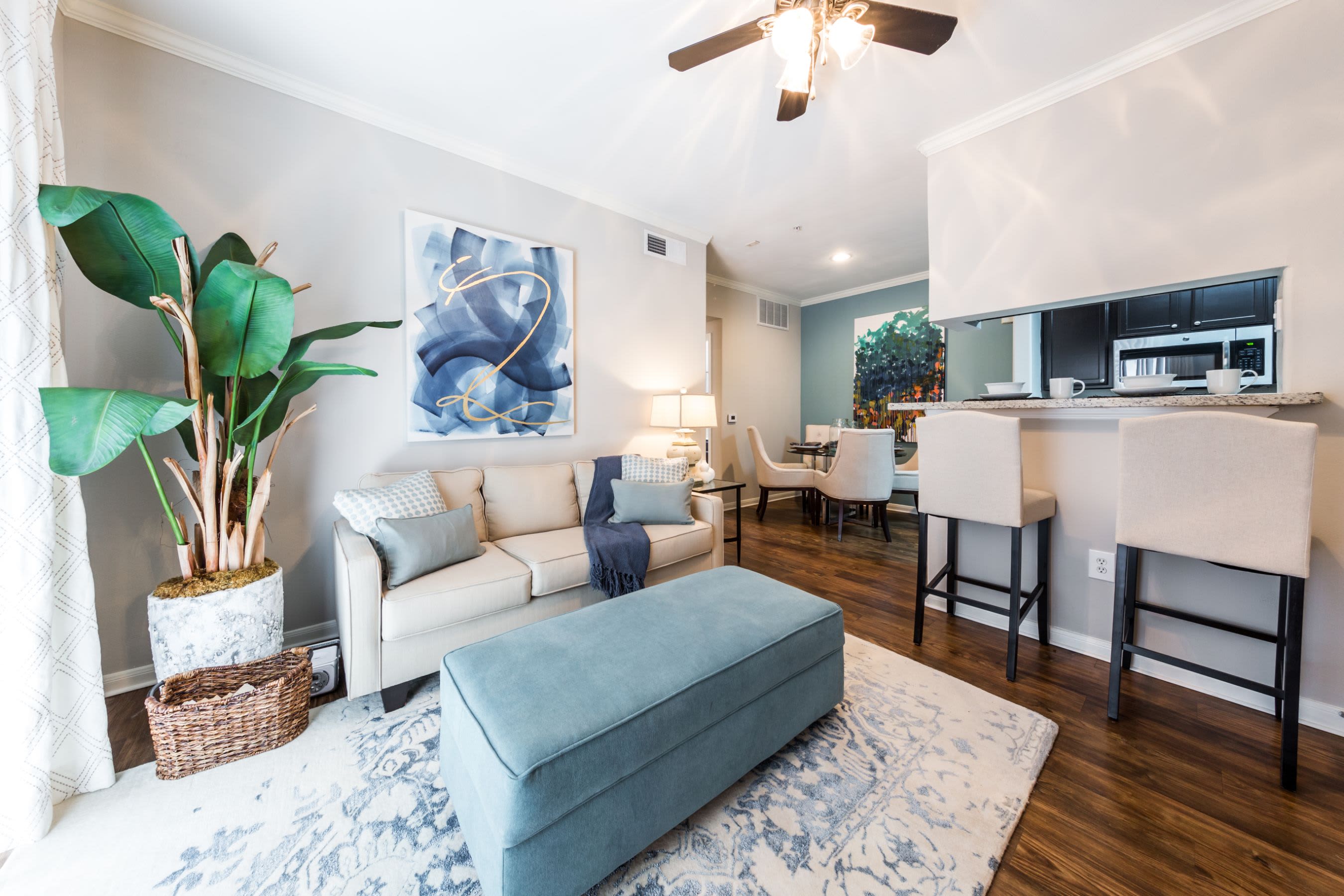 Living area with wood style floors at Marquis on Westheimer in Houston, Texas