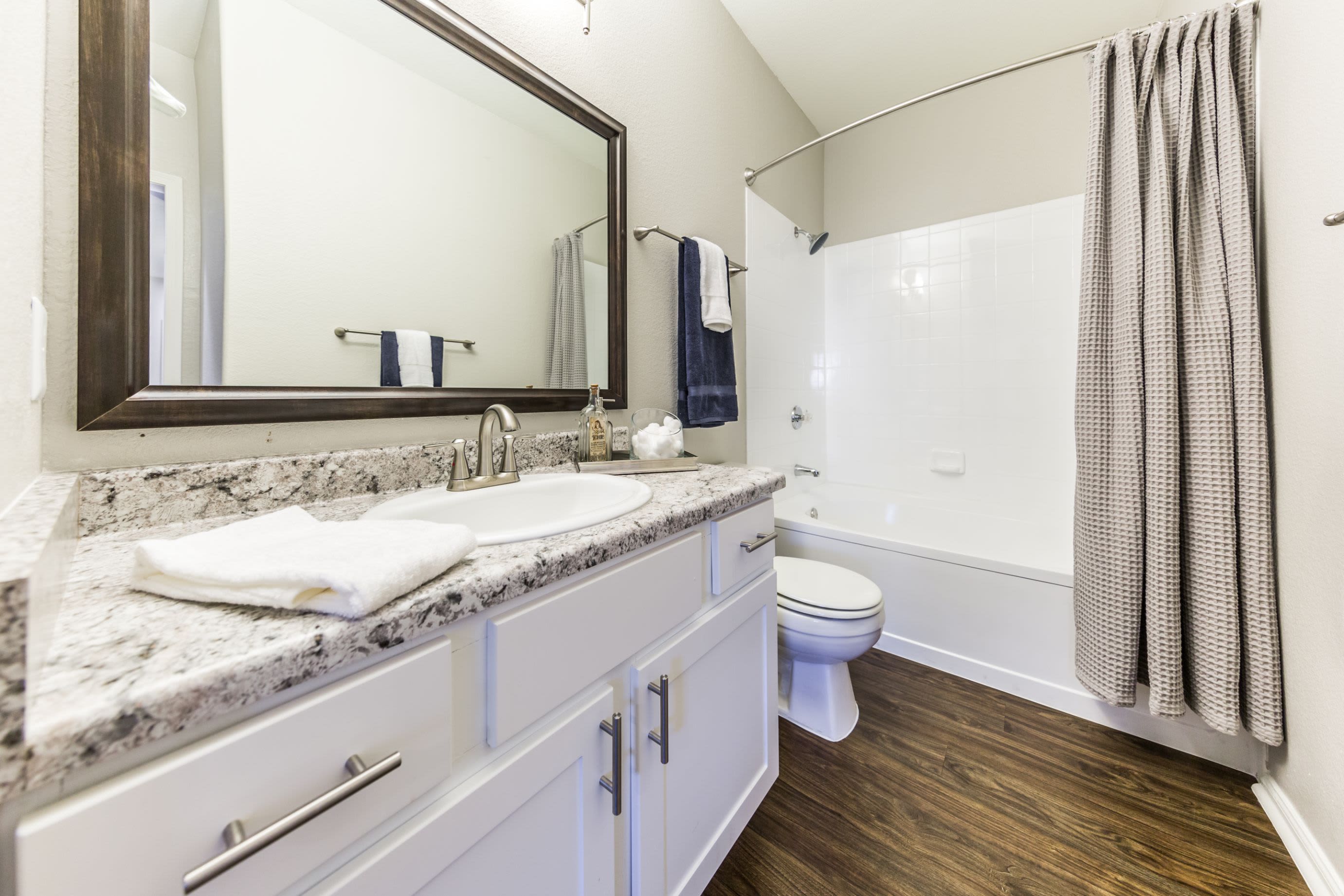 Bathroom with wood style floors at Marquis at Arrowhead in Peoria, Arizona