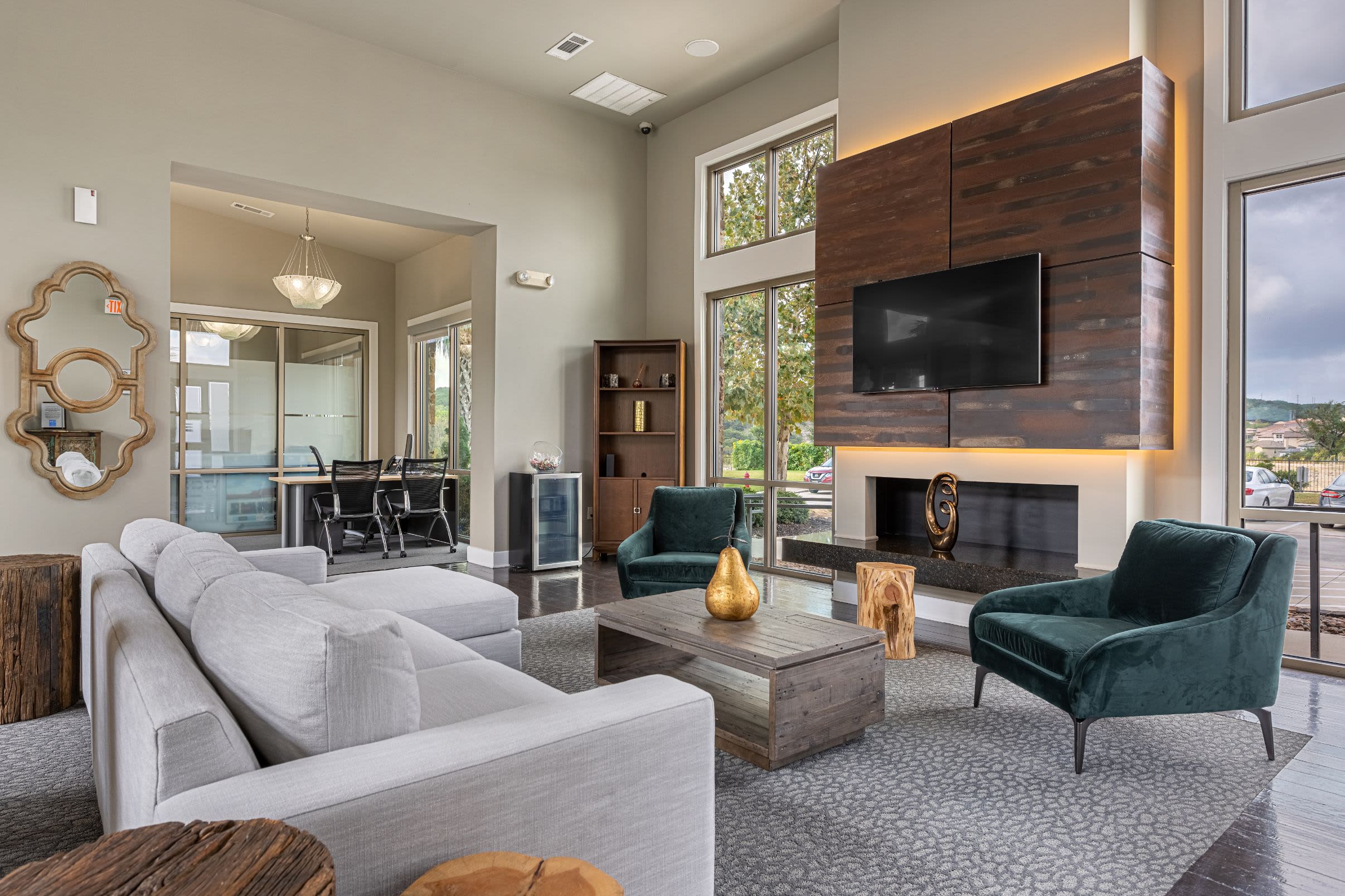 Clubhouse with couch and TV at Marquis Cresta Bella in San Antonio, Texas