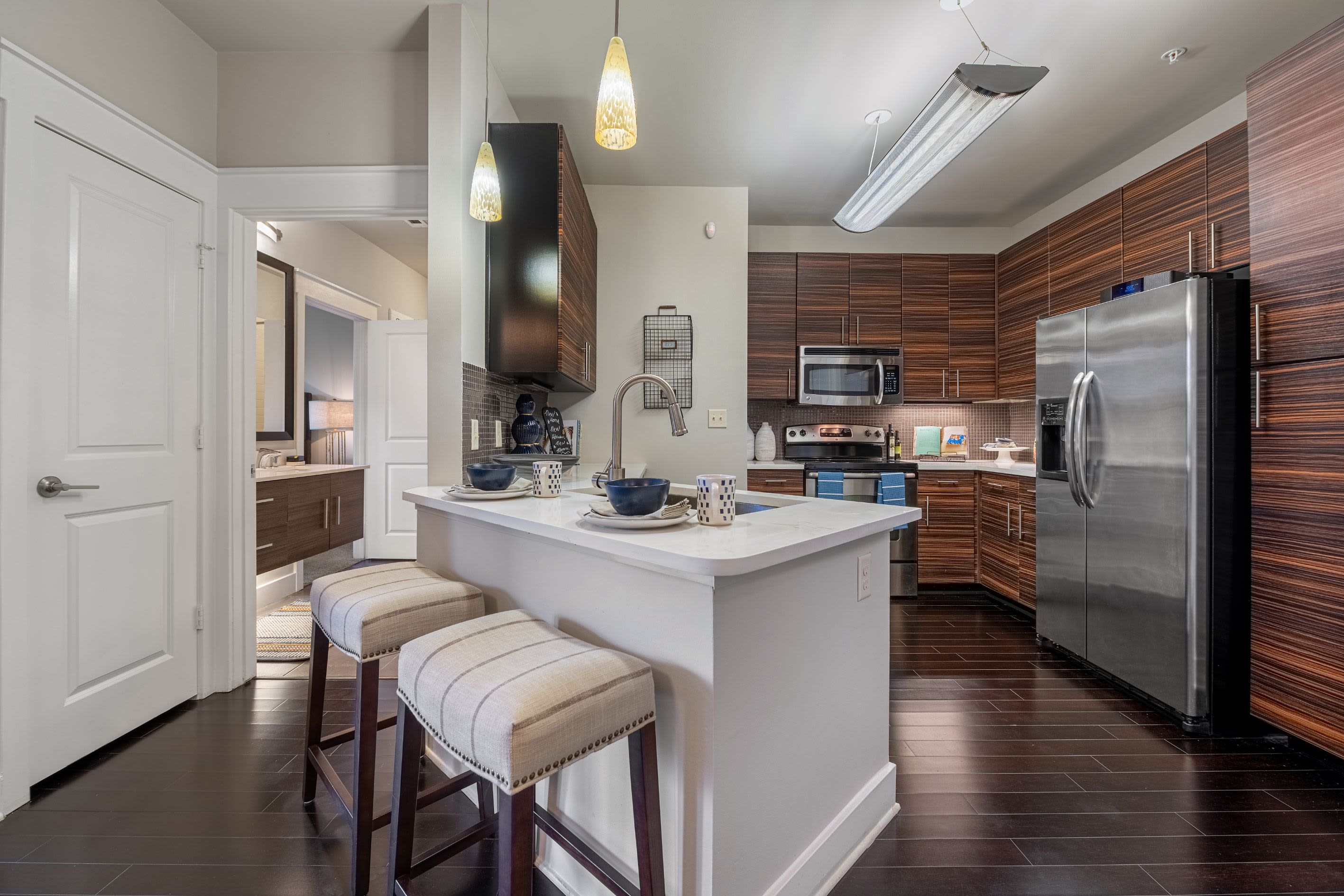 Kitchen with breakfast bar at Marquis Cresta Bella in San Antonio, Texas