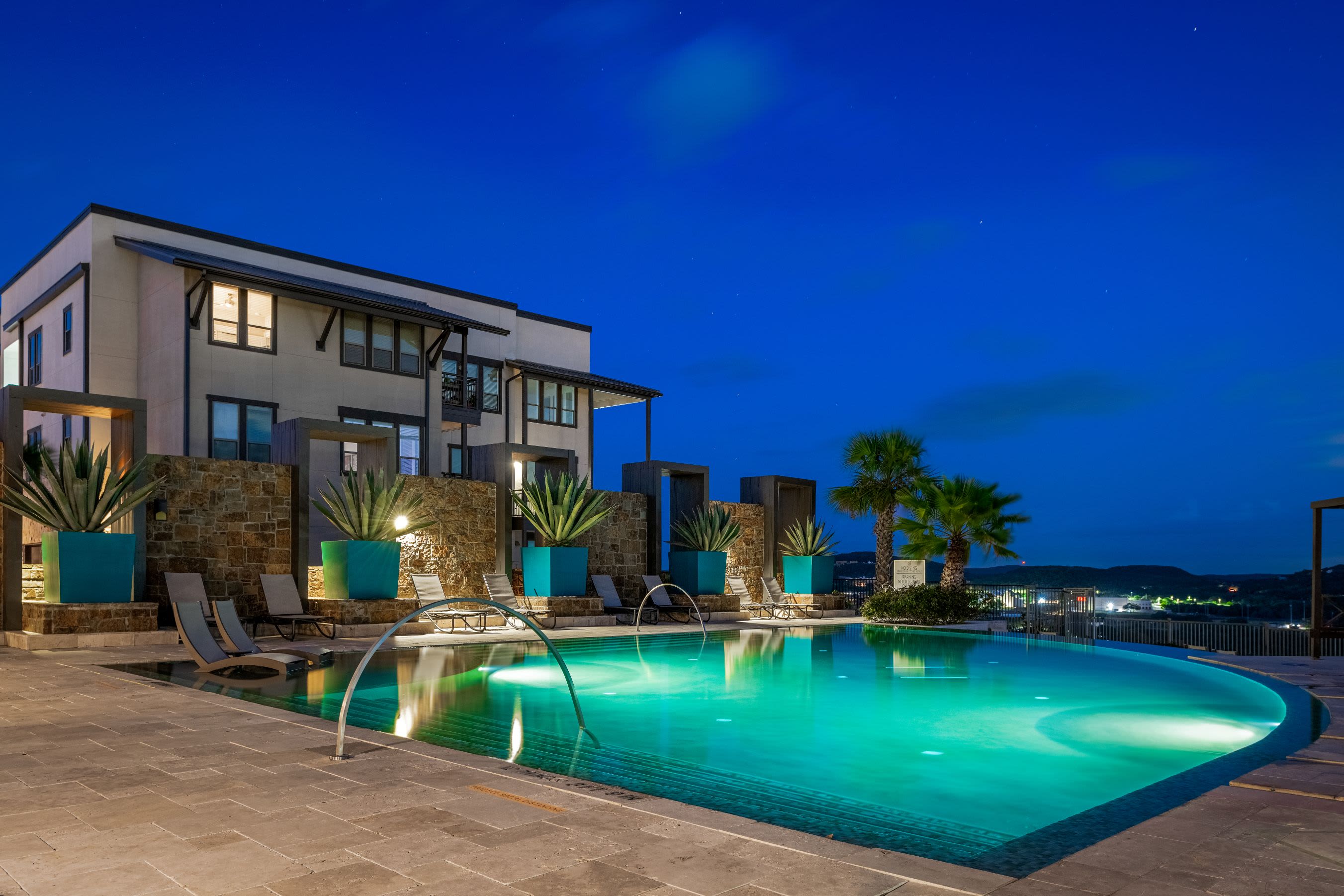 Swimming pool at night at Marquis Cresta Bella in San Antonio, Texas