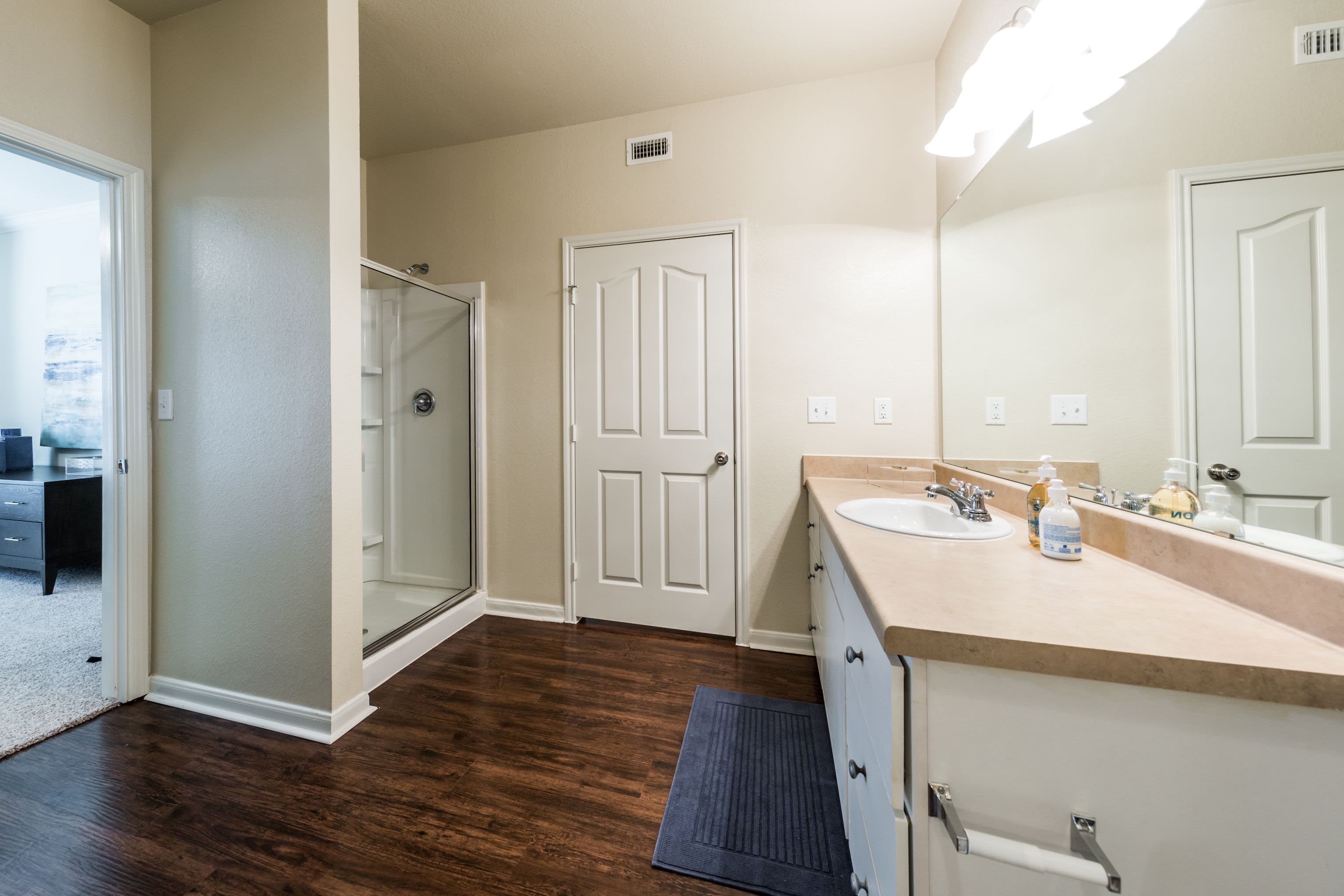 Bathroom with wood style floors at Marquis at The RIM in San Antonio, Texas