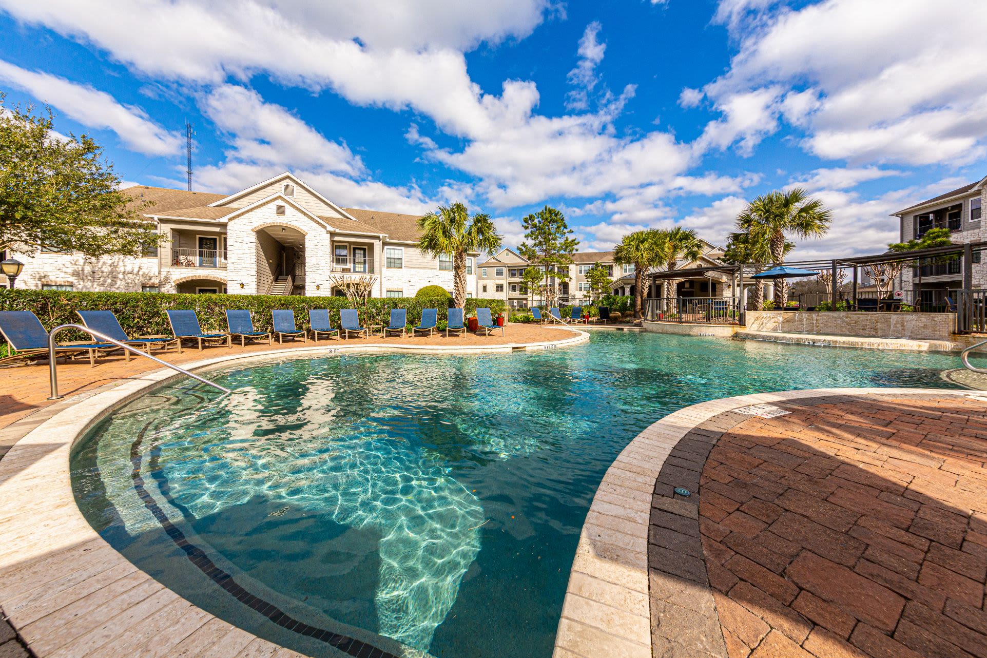 Resort style swimming pool at Marquis Grand Lakes in Richmond, Texas