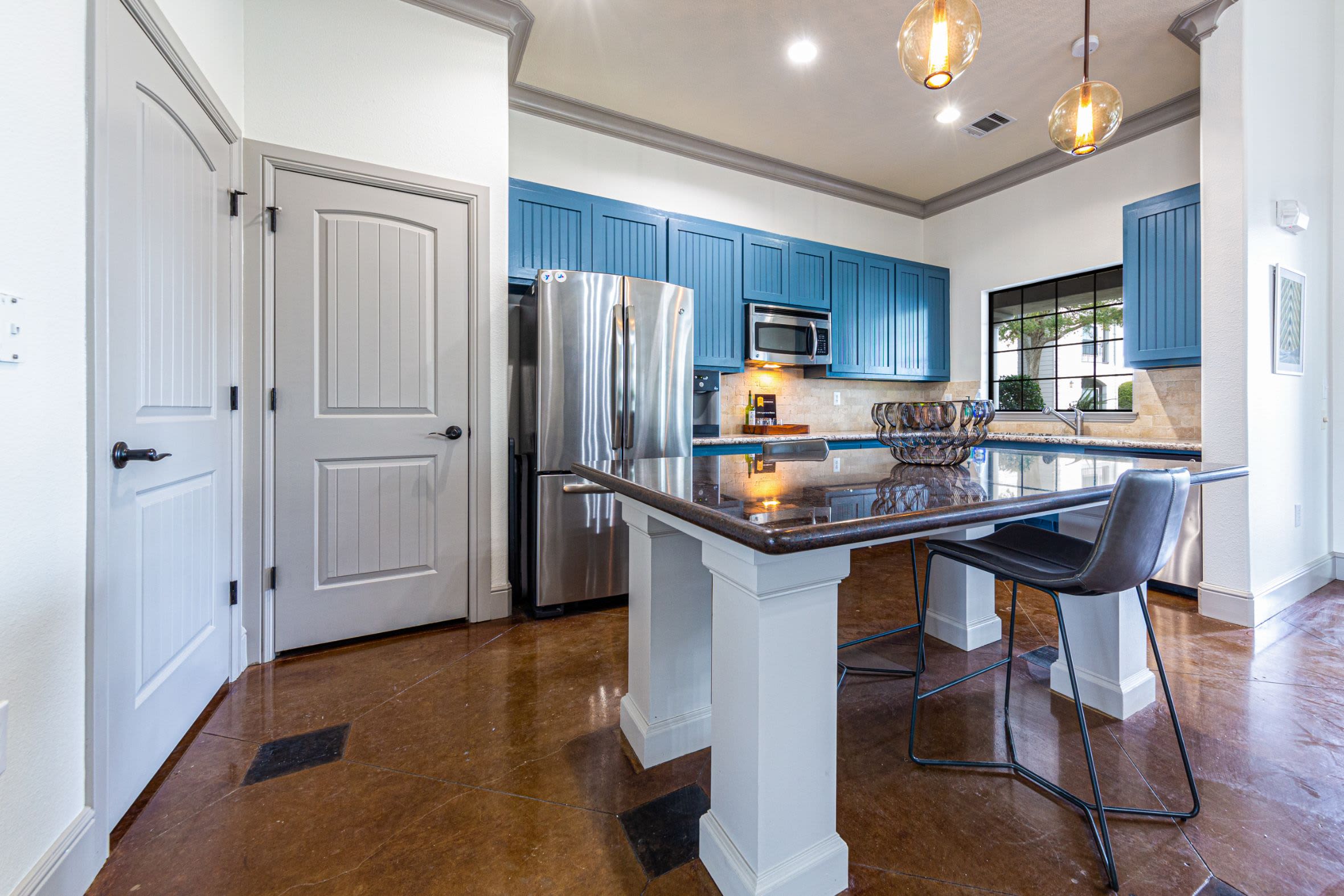 Kitchen in community clubhouse at Marquis Grand Lakes in Richmond, Texas