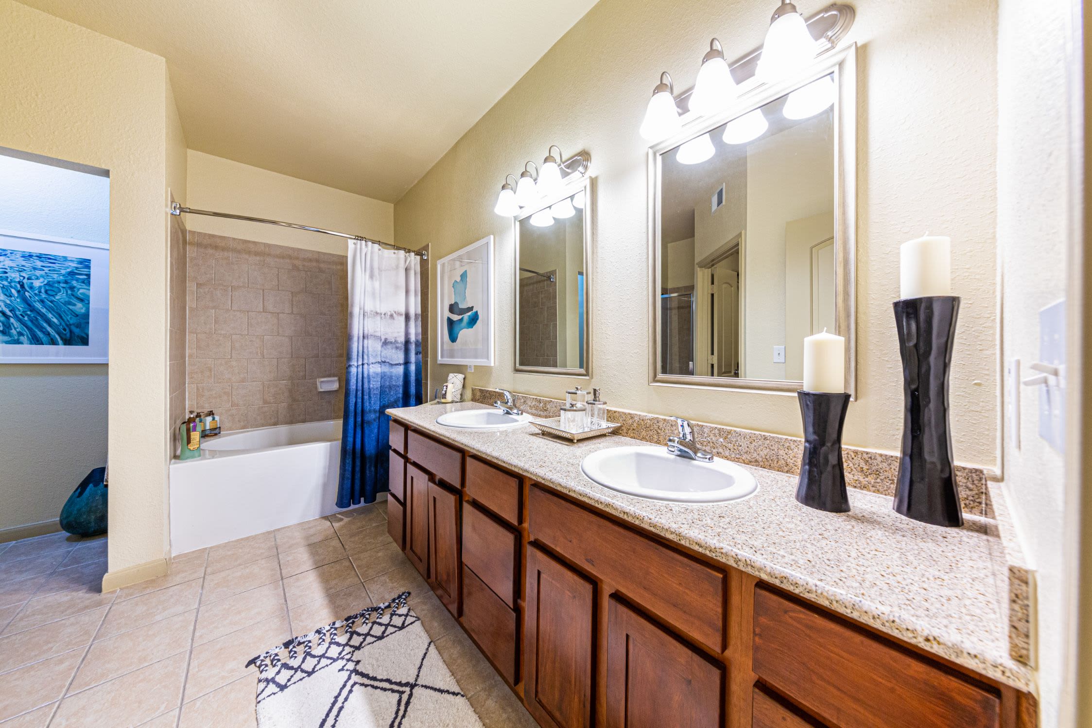 Bathroom with white countertops at Marquis Grand Lakes in Richmond, Texas