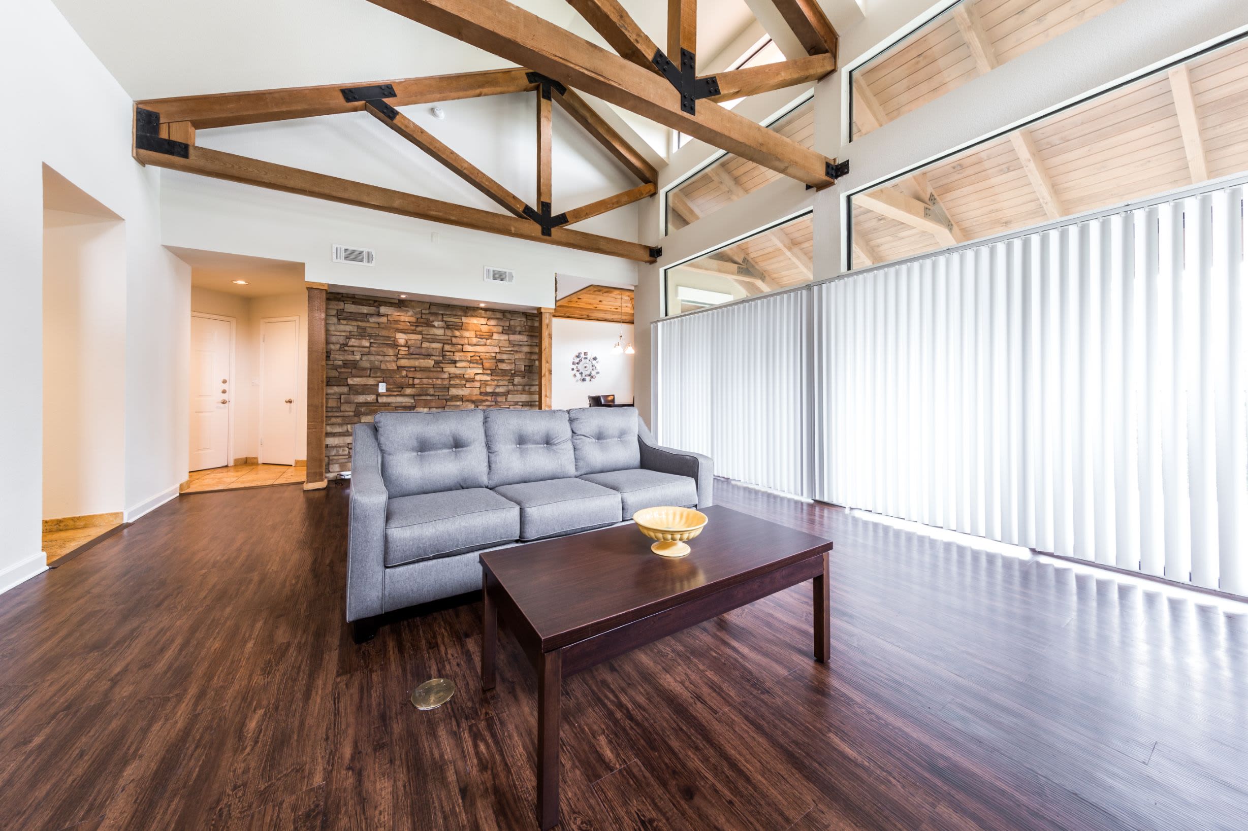 Living room with large windows at Marquis at Caprock Canyon in Austin, Texas