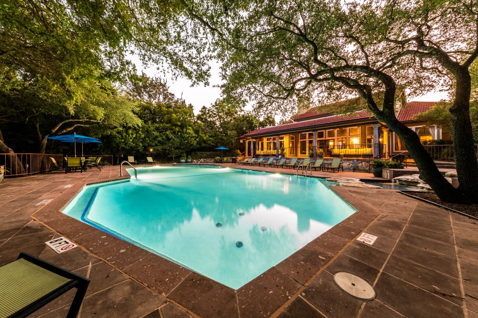 Swimming pool with sun chairs at Marquis at Caprock Canyon in Austin, Texas