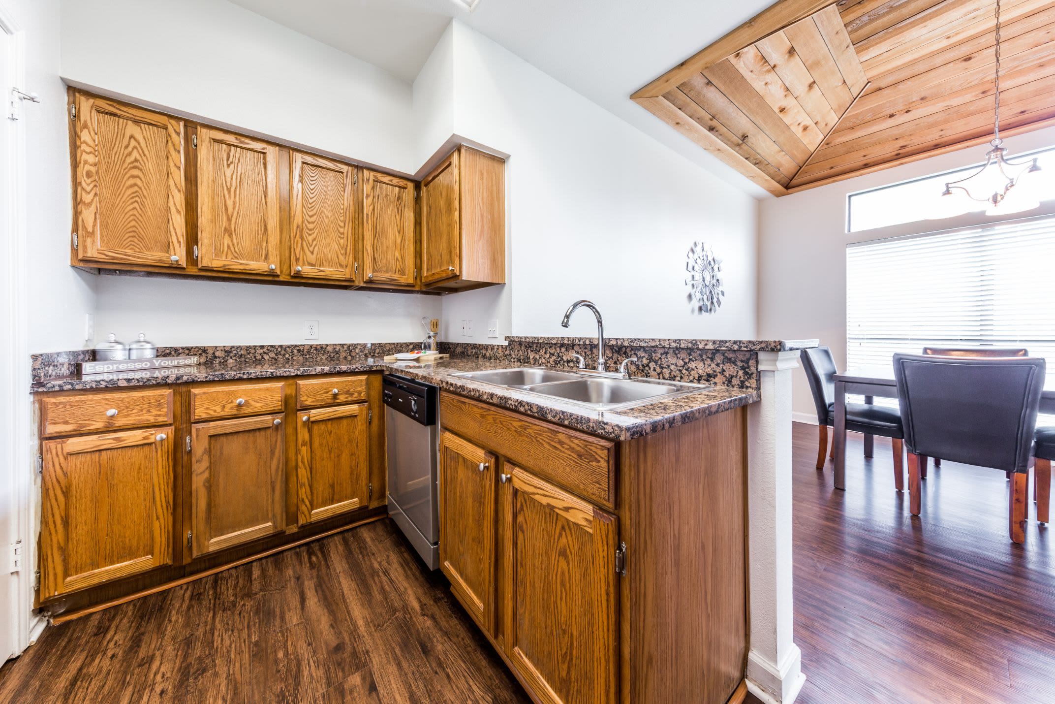 Kitchen with wood style floors at Marquis at Caprock Canyon in Austin, Texas