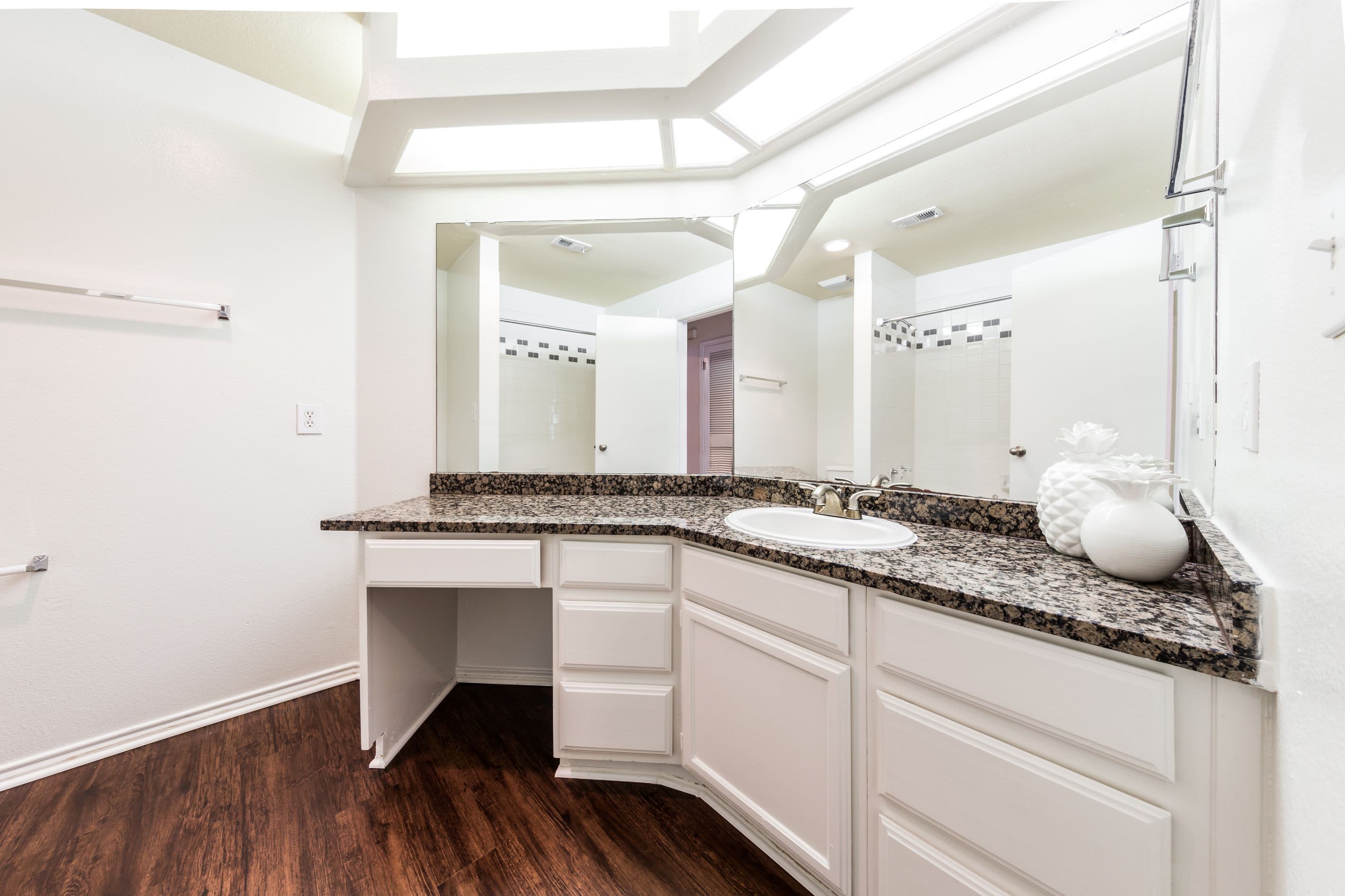 Large vanity with white cabinets at Marquis at Caprock Canyon in Austin, Texas