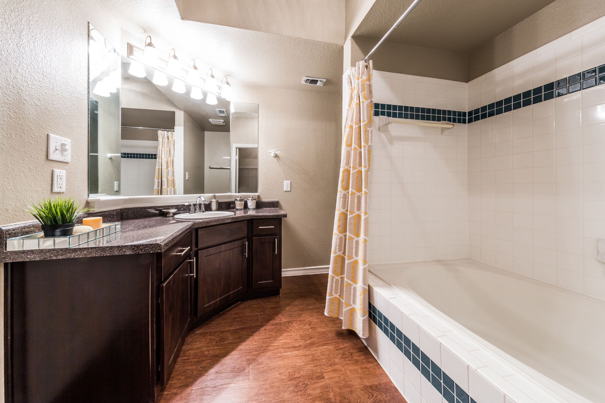 Bathroom with a bathtub and shower at Marquis at Deerfield in San Antonio, Texas