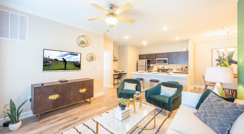 Spacious living room and kitchen area in a model home at The Isaac in Summerville, South Carolina