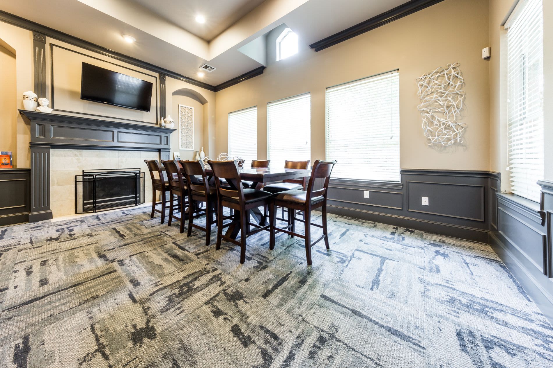 Table and chairs in clubhouse at Brooks on Preston in Plano, Texas