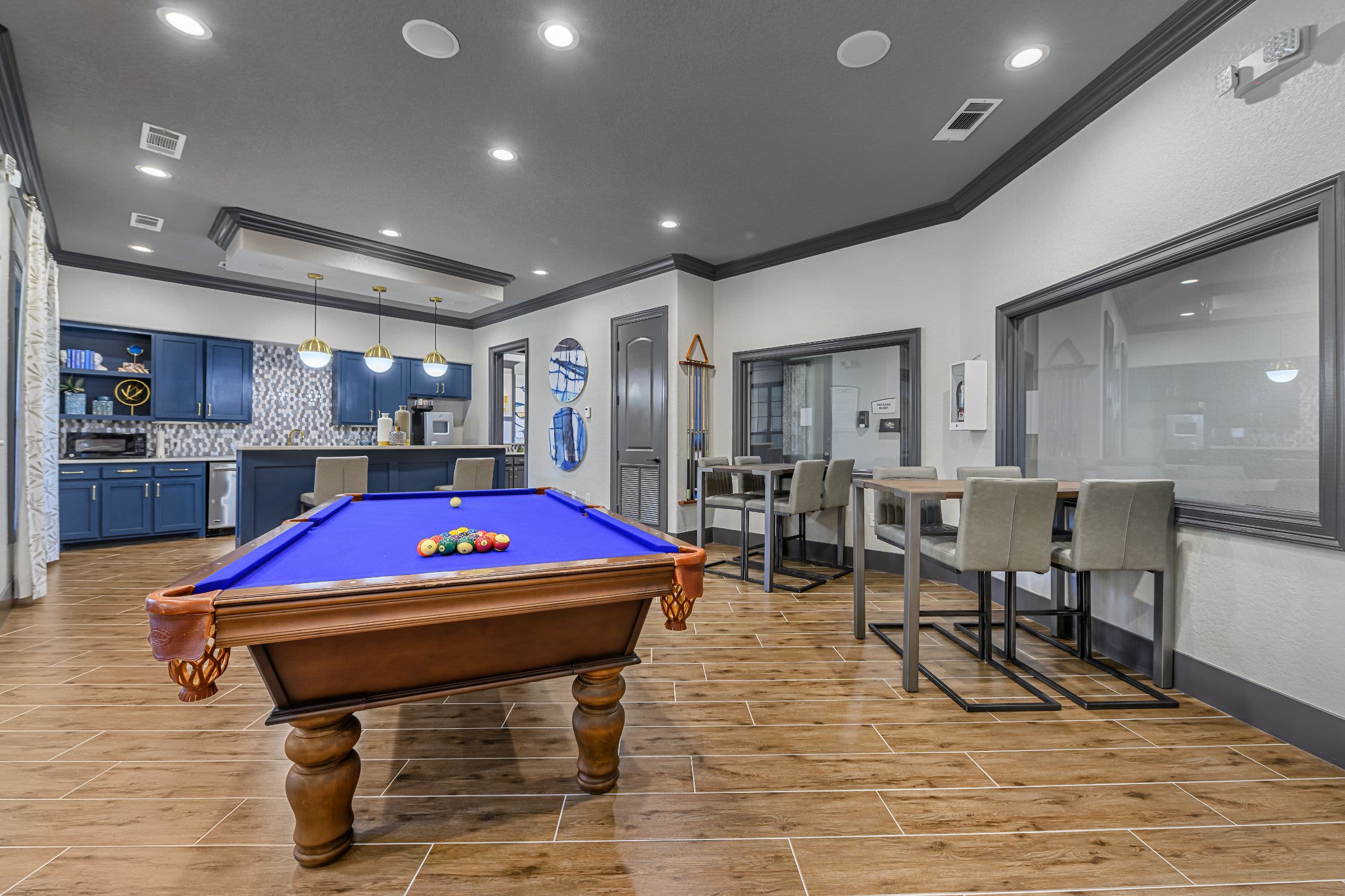 Pool table and kitchenette in clubhouse at Marquis Lakeline Station in Austin, Texas